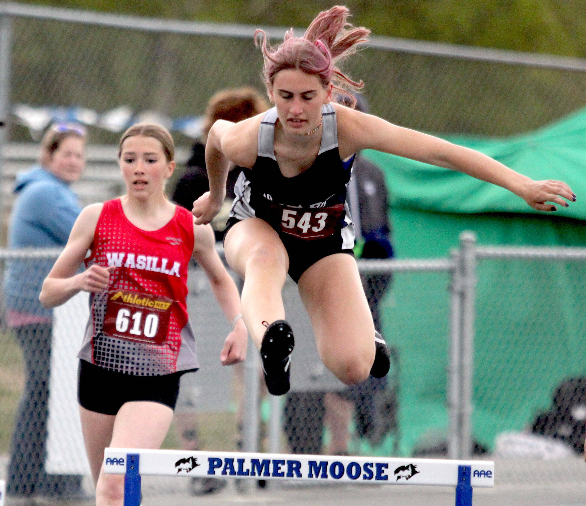 Soldotna’s Hallie Fischer clears a hurdles in the girls 300-meter hurdles during the preliminaries of the Region 3 track and field meet Friday, May 19, 2023, at Palmer High School in Palmer, Alaska. (Jeremiah Bartz/Frontiersman)