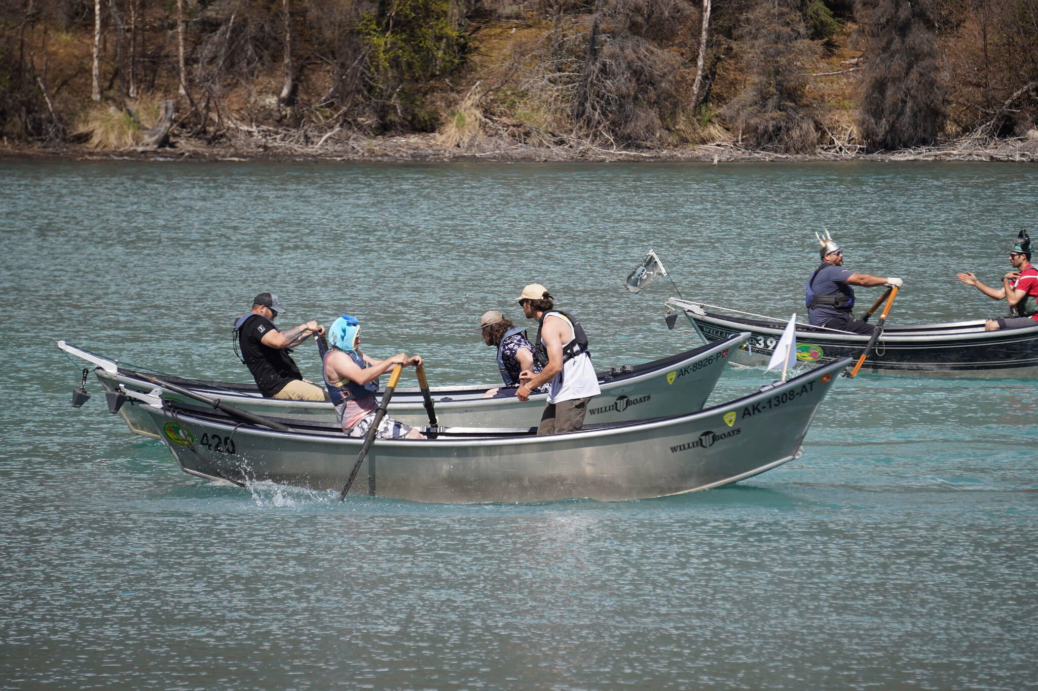 Contestants race down the Kenai River during the 16th Annual Cooper Landing Drift Boat Regatta near the Eagle Landing Resort in Cooper Landing, Alaska, on Saturday, May 20, 2023. (Jake Dye/Peninsula Clarion)