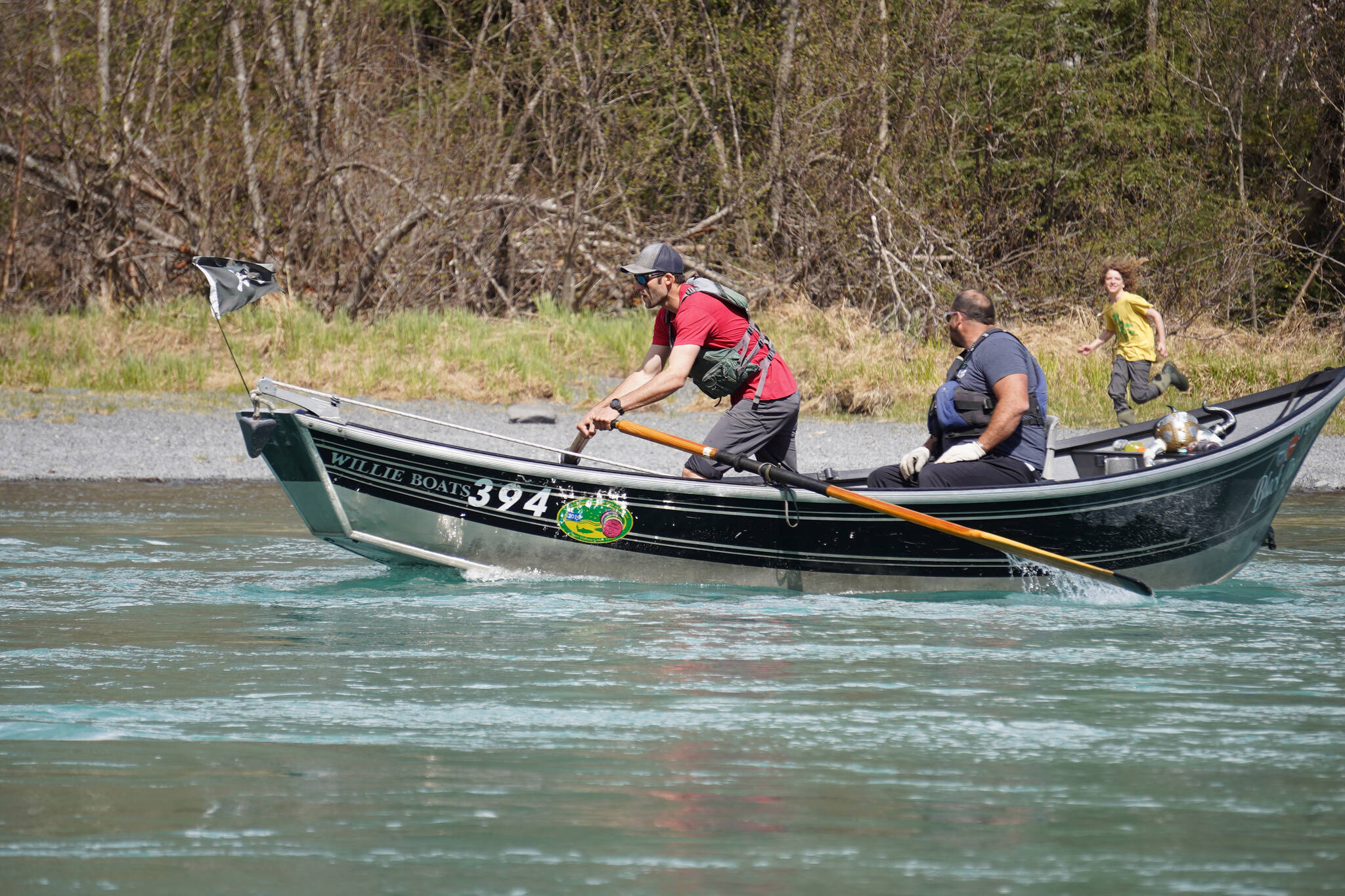 Contestants race down the Kenai River during the 16th Annual Cooper Landing Drift Boat Regatta near the Kenai Princess Wilderness Lodge in Cooper Landing, Alaska, on Saturday, May 20, 2023. (Jake Dye/Peninsula Clarion)