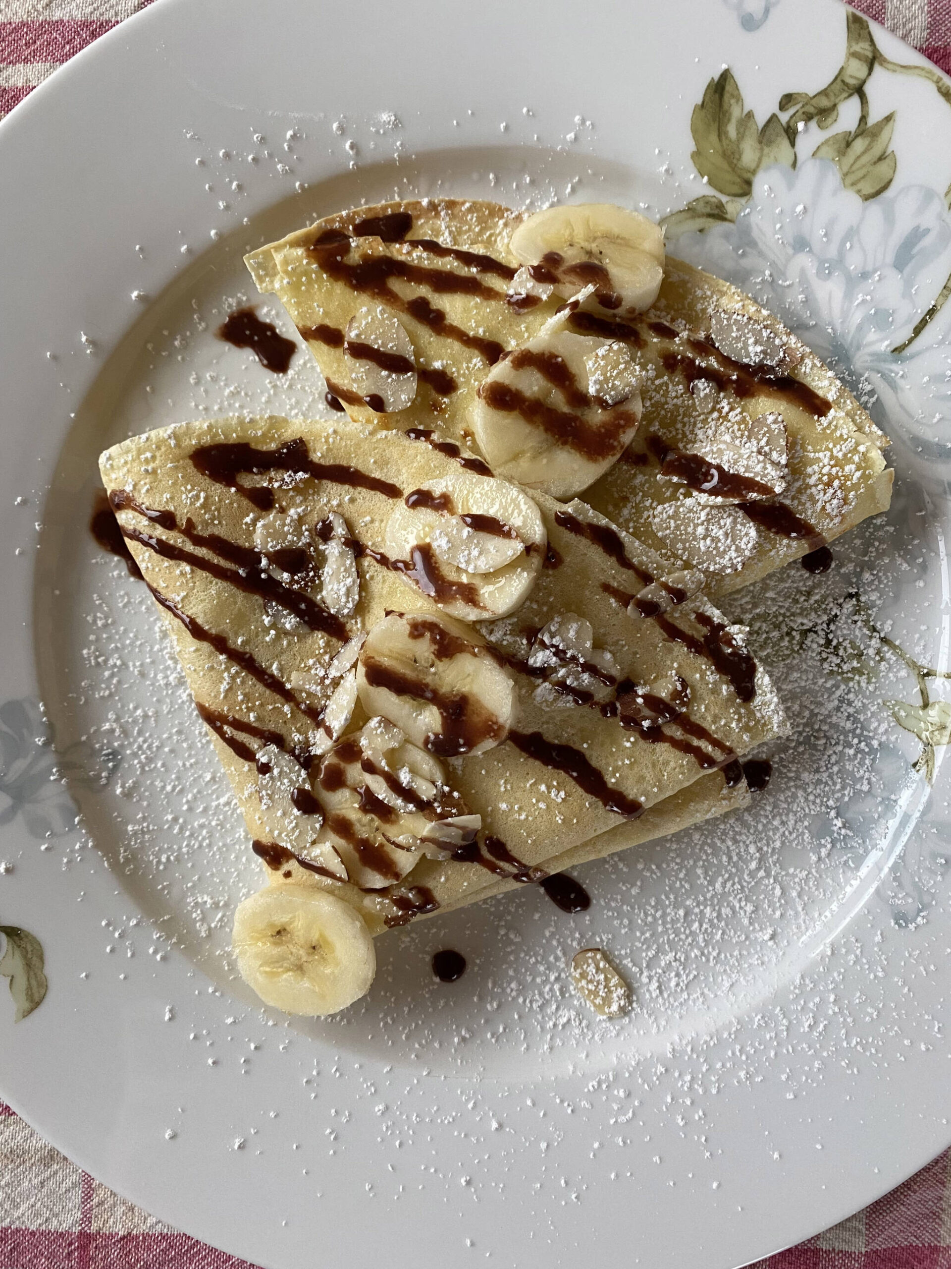 The simple yet versatile crepe can be served savory or sweet, such as this banana, powdered sugar and chocolate creation. (Photo by Tressa Dale/Peninsula Clarion)