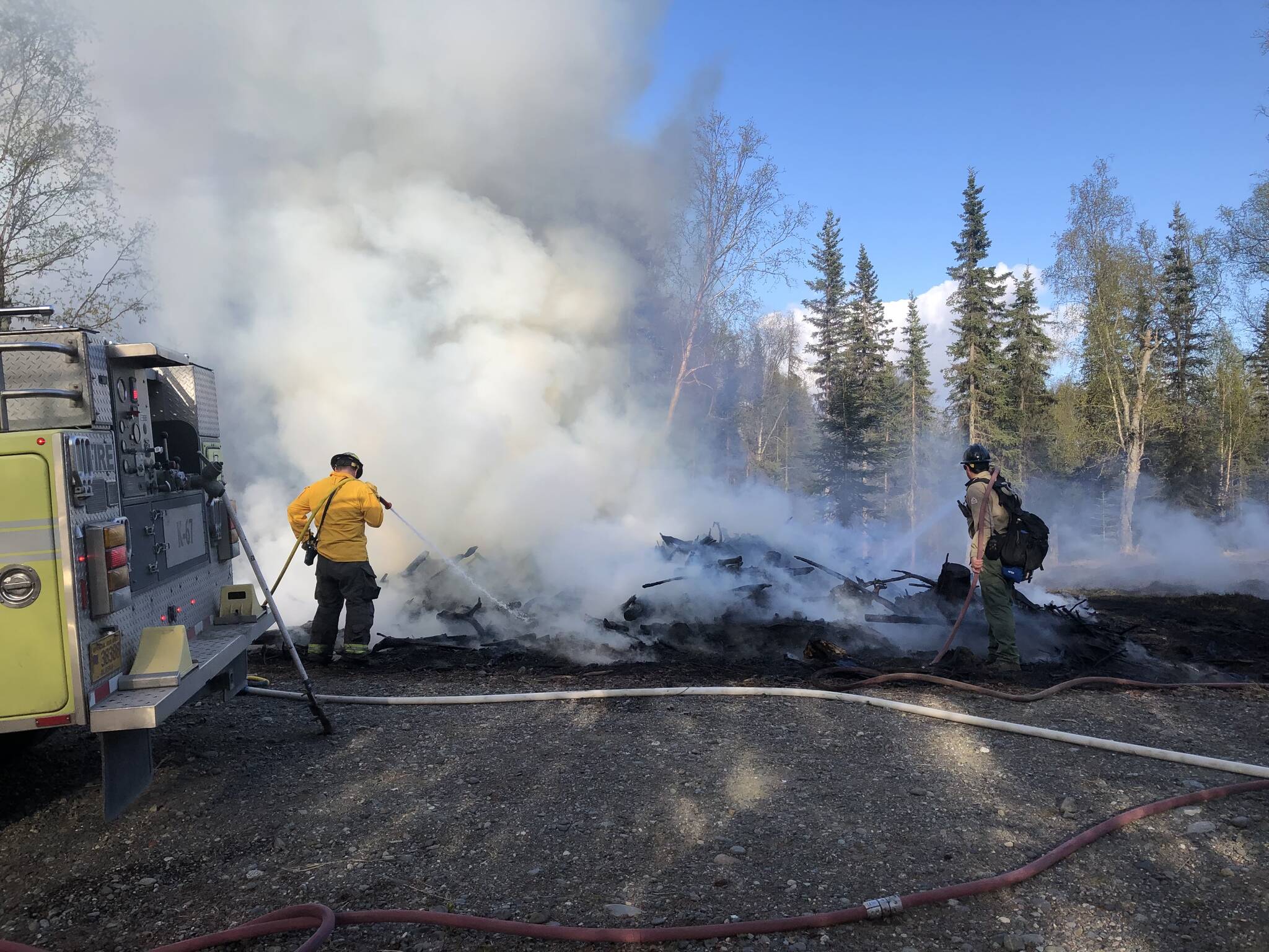 Firefighters work to extinguish the Charland Fire on Sunday, May 21, 2023, near Soldotna. (Photo courtesy Kenai-Kodiak DOF)