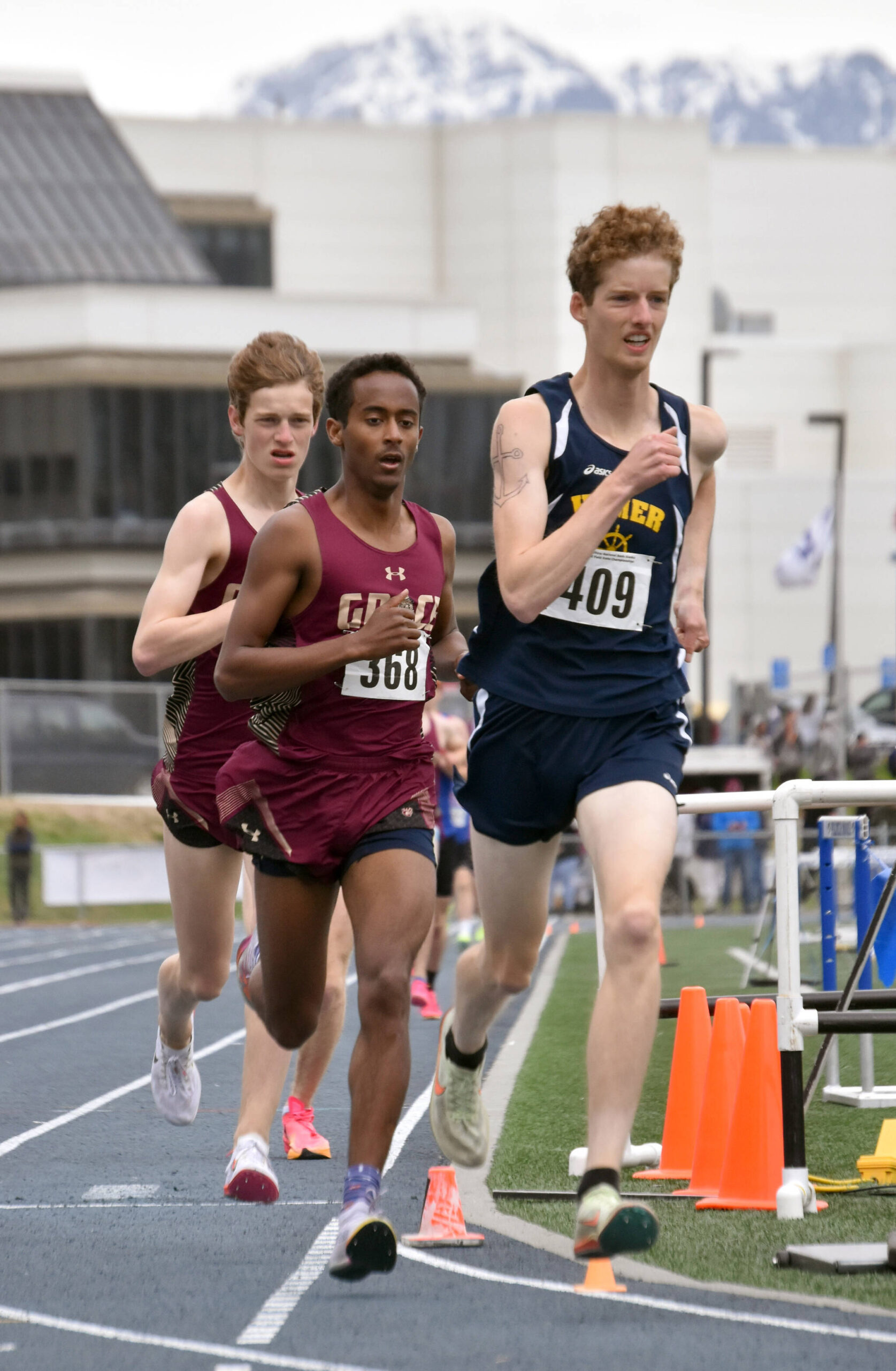 Homer’s Seamus McDonough is chased by Grace Christian’s David Sliwinski and Robbie Annett in the Division II 1,600-meter run Saturday, May 27, 2023, at the state track and field meet at Palmer High School in Palmer, Alaska. (Photo by Jeff Helminiak/Peninsula Clarion)