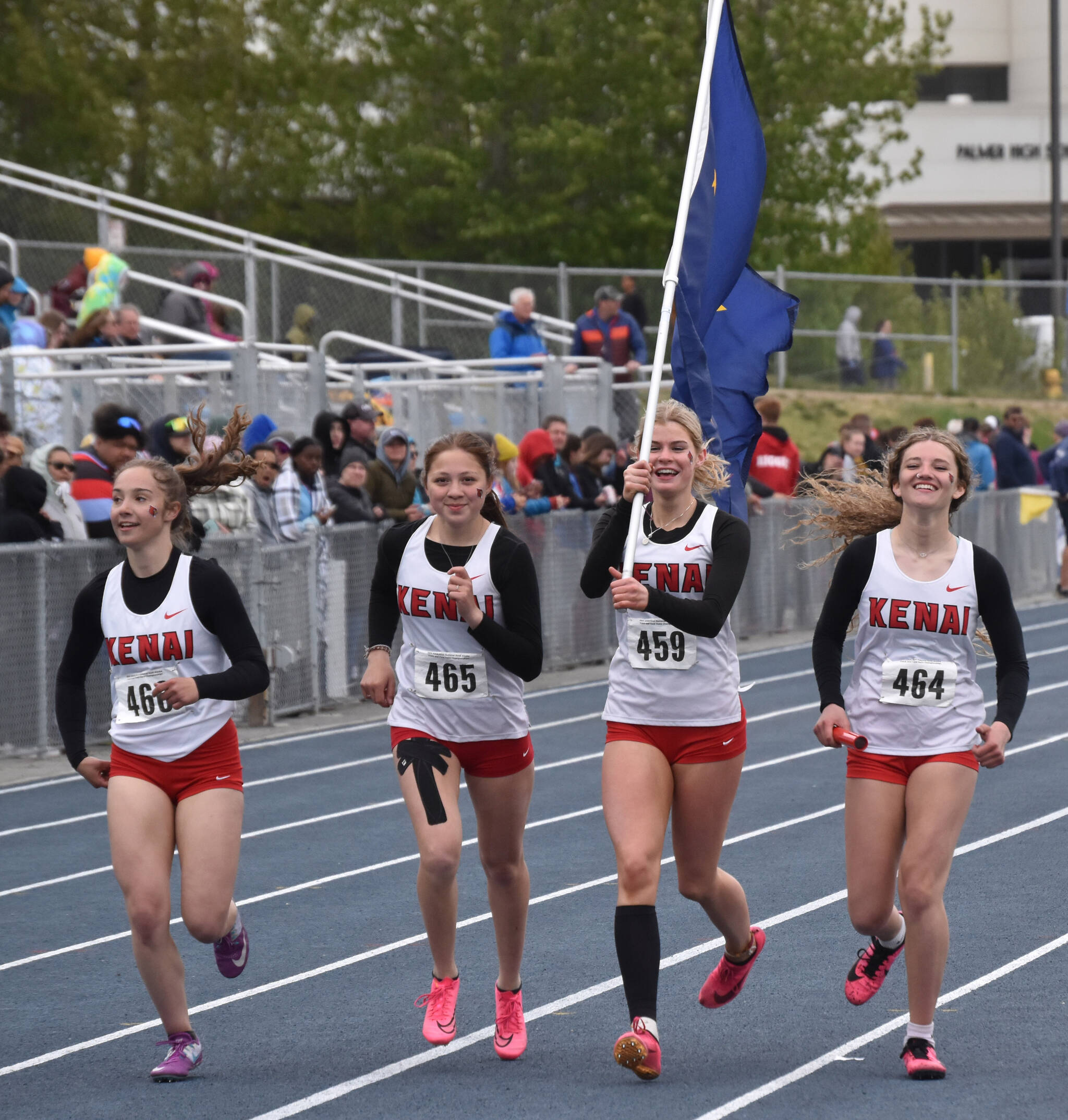 Kenai’s Central’s Sierra Hershberger, Emilee Wilson, Malena Grieme and Sophie Tapley celebrate victory in the Division I 400 relay Saturday, May 27, 2023, at the state track and field meet at Palmer High School in Palmer, Alaska. (Photo by Jeff Helminiak/Peninsula Clarion)