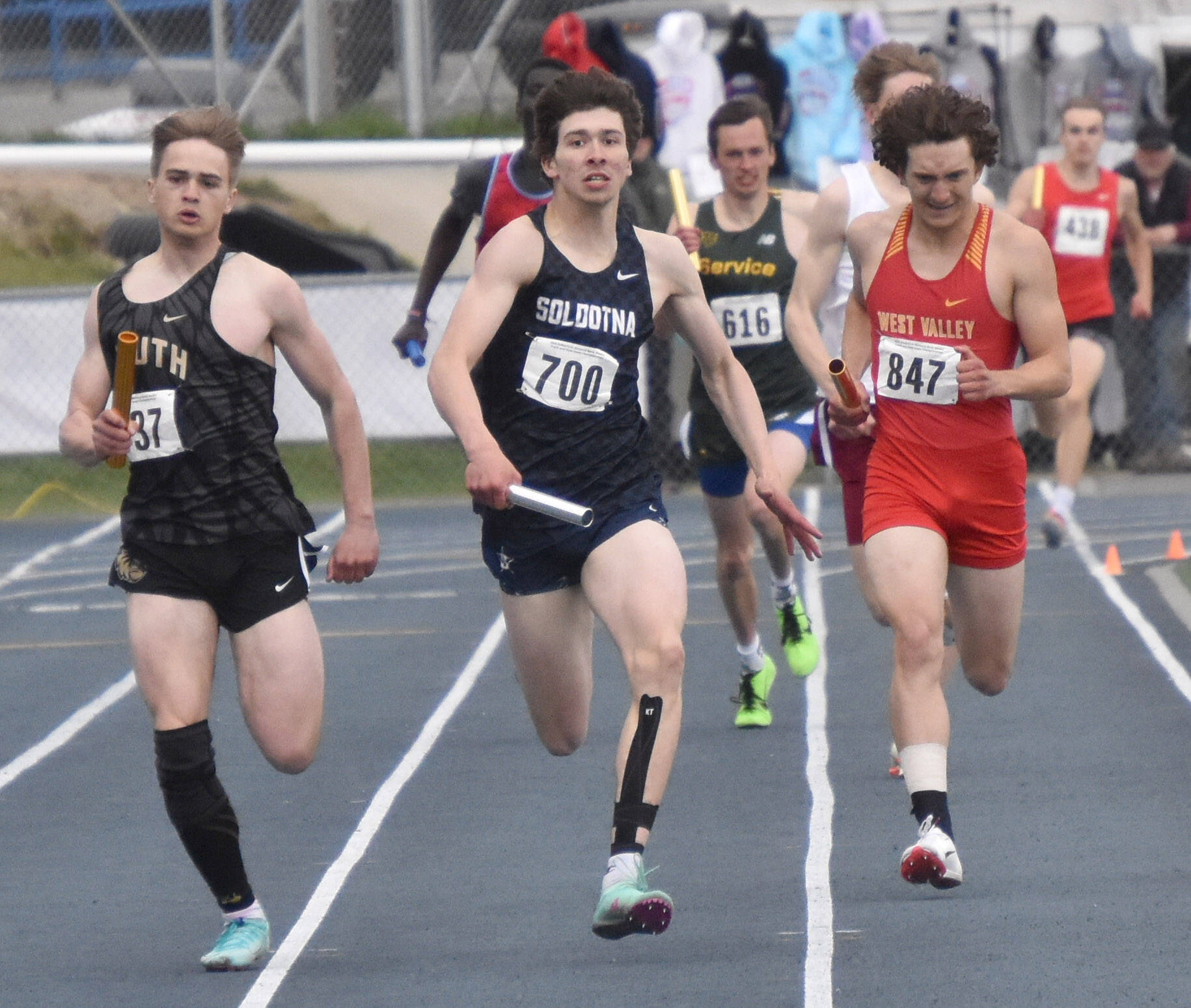 Soldotna’s Leigh Tacey II battles to second place in the Division I 1,600-meter relay Saturday, May 27, 2023, at the state track and field meet at Palmer High School in Palmer, Alaska. (Photo by Jeff Helminiak/Peninsula Clarion)