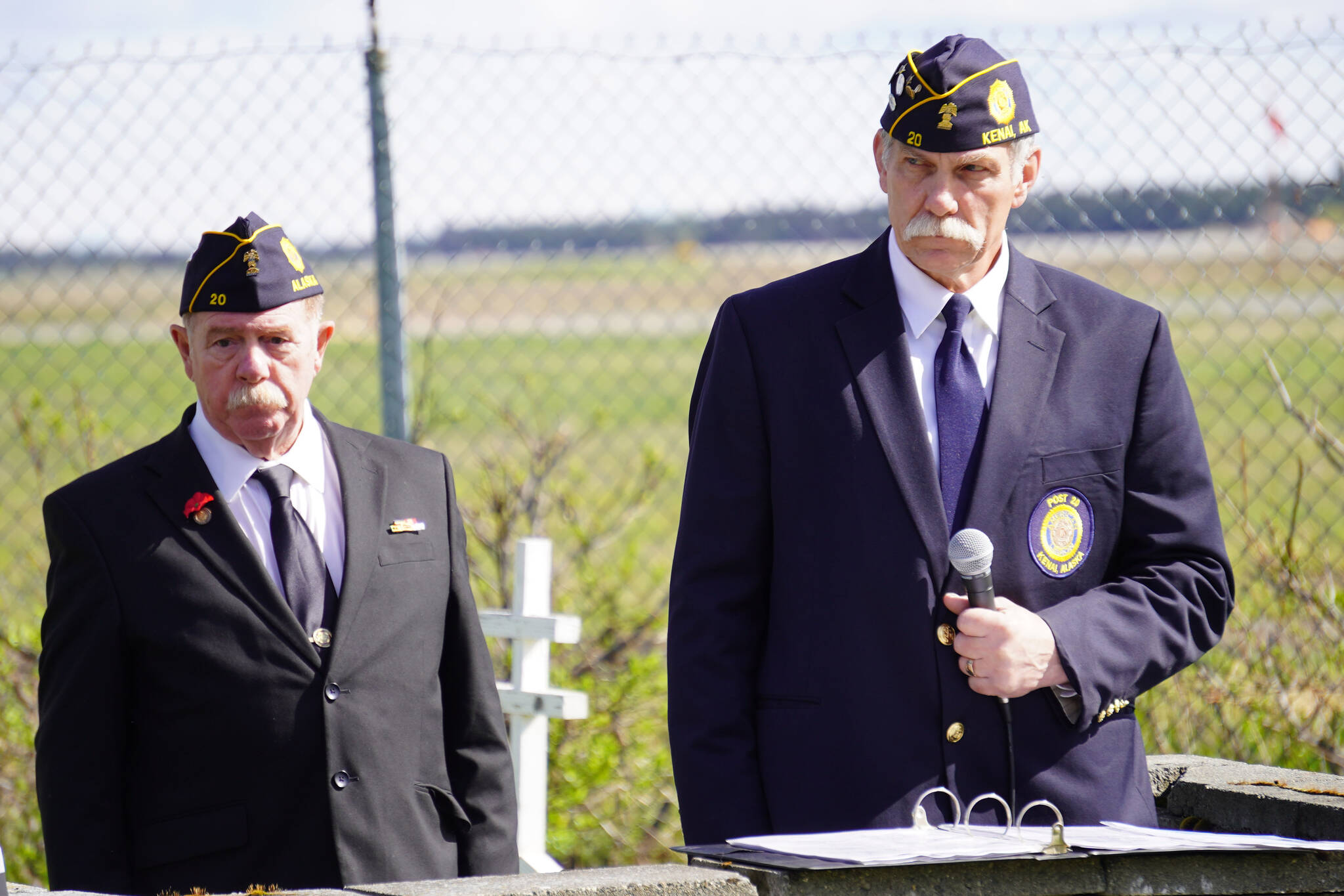 American Legion Post 20 Chaplain Mike Meredith and Cmdr. Ron Homan stand during a Memorial Day ceremony on Monday, May 29, 2023, at the Kenai Cemetery in Kenai, Alaska. (Jake Dye/Peninsula Clarion)