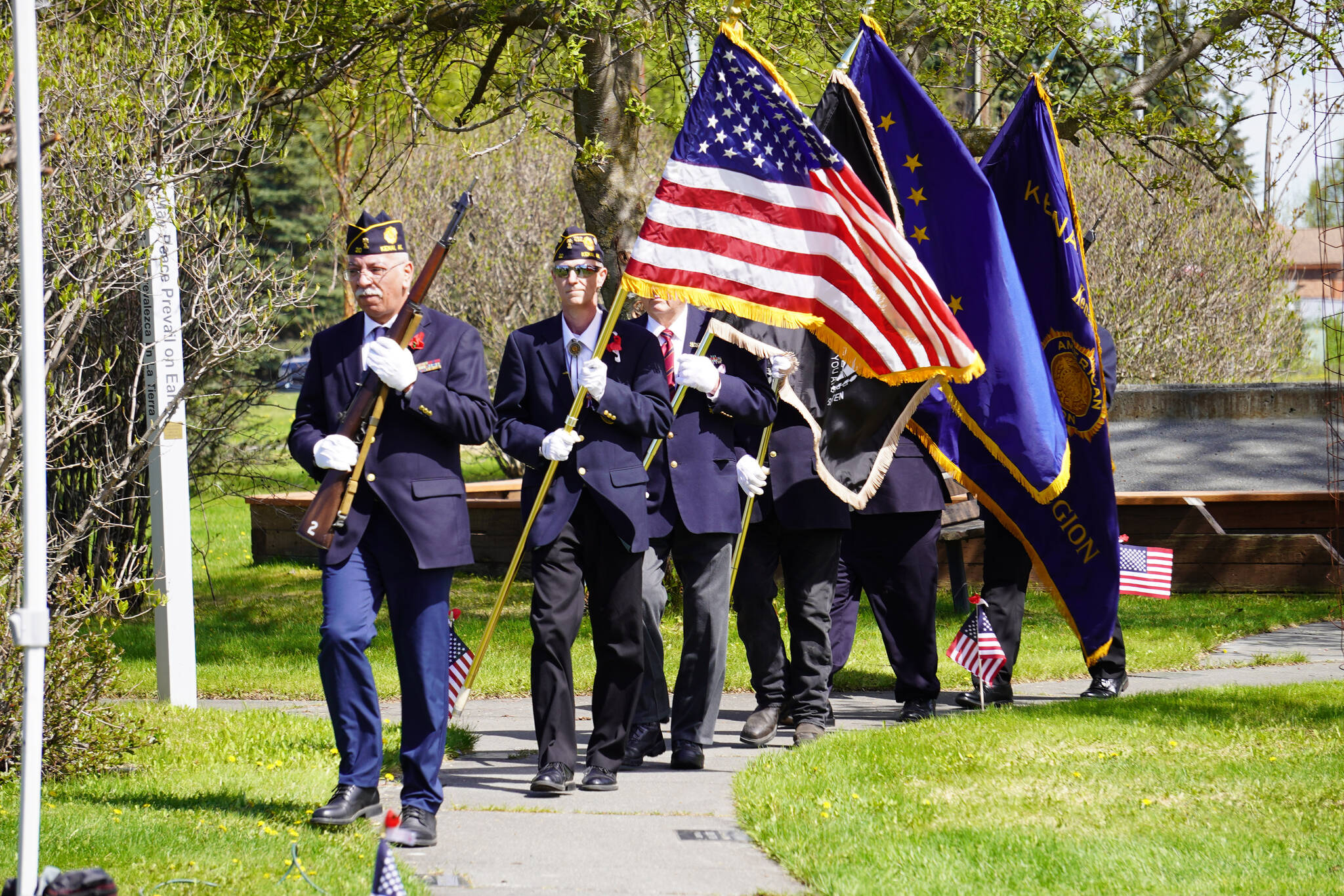 The American Legion Post 20 Color Guard holds a procession during a Memorial Day ceremony on Monday, May 29, 2023, at Leif Hanson Memorial Park in Kenai, Alaska. (Jake Dye/Peninsula Clarion)