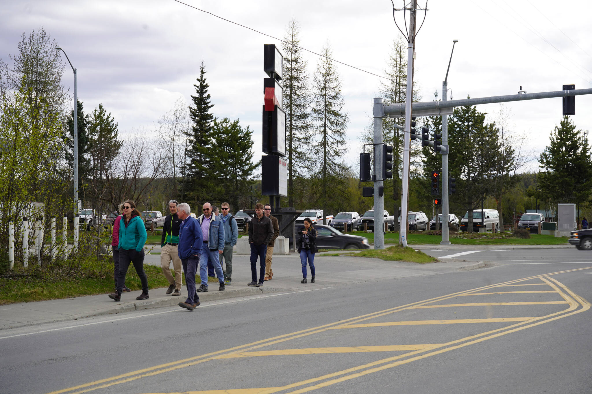 Soldotna Director of Economic Development and Planning John Czarnezki leads a party of transportation professionals on a tour of the Sterling Highway and Birch Avenue intersection in Soldotna, Alaska, on Monday, May 22, 2023. (Jake Dye/Peninsula Clarion)