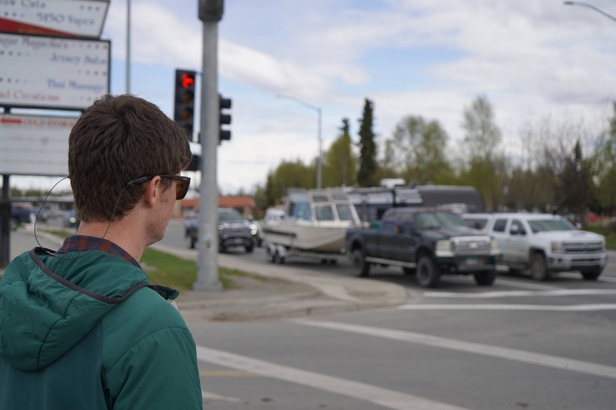 Orion LeCroy, a member of the state Department of Transportation, tours the Sterling Highway and Birch Avenue intersection in Soldotna, Alaska, on Monday, May 22, 2023. (Jake Dye/Peninsula Clarion)