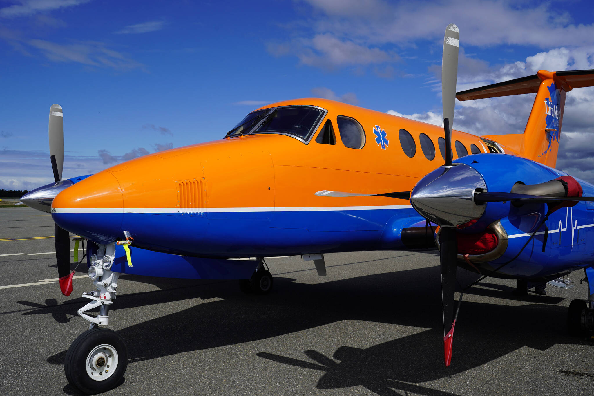 A plane operated by LifeMed Alaska is displayed at the Kenai Peninsula Air Fair on Saturday, June 10, 2023, at the Kenai Municipal Airport in Kenai, Alaska. (Jake Dye/Peninsula Clarion)
