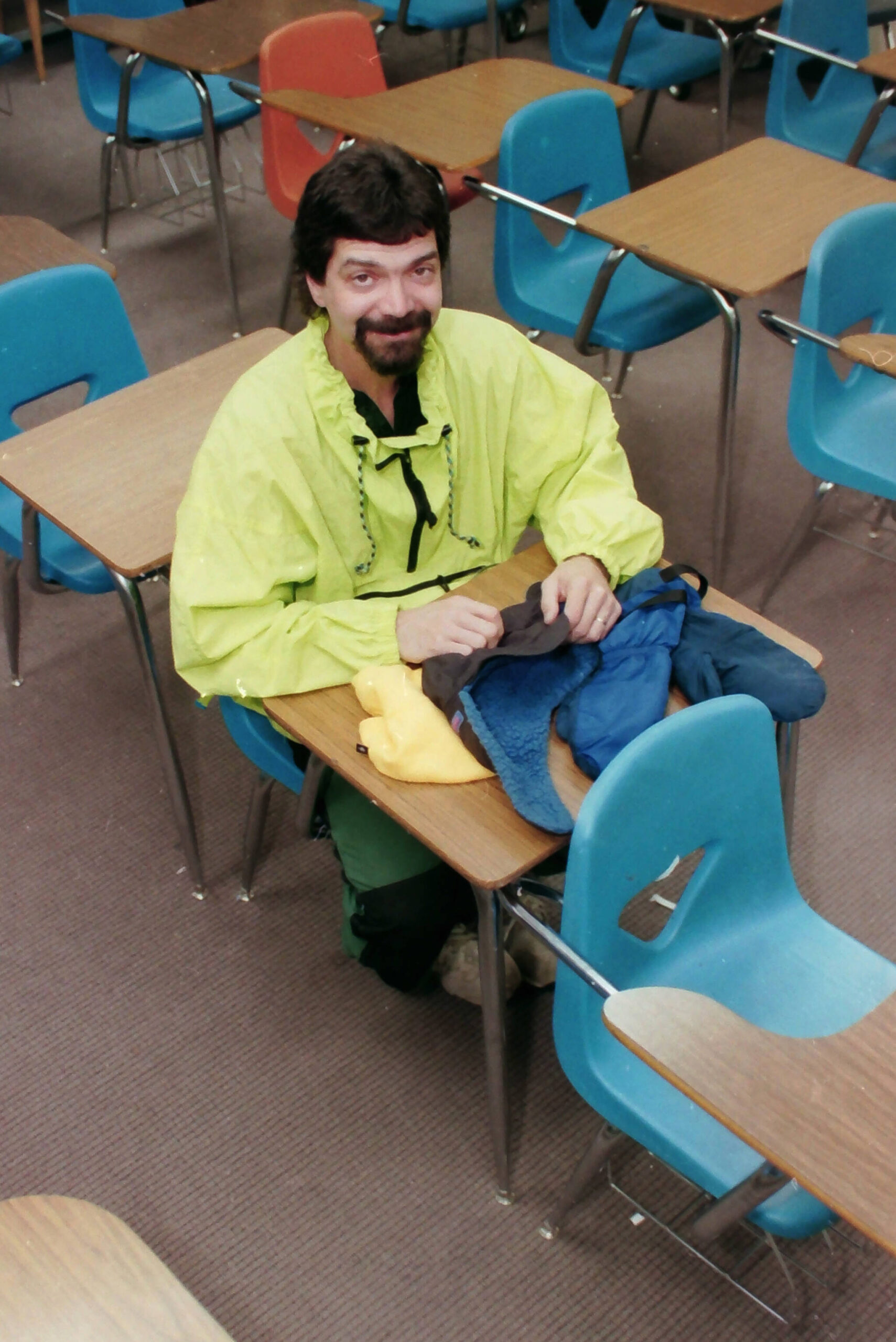 Robert Summer sits at a desk in his classroom at Kenai Middle School in Kenai, Alaska, in April 1997. (M. Scott Moon/Peninsula Clarion file)