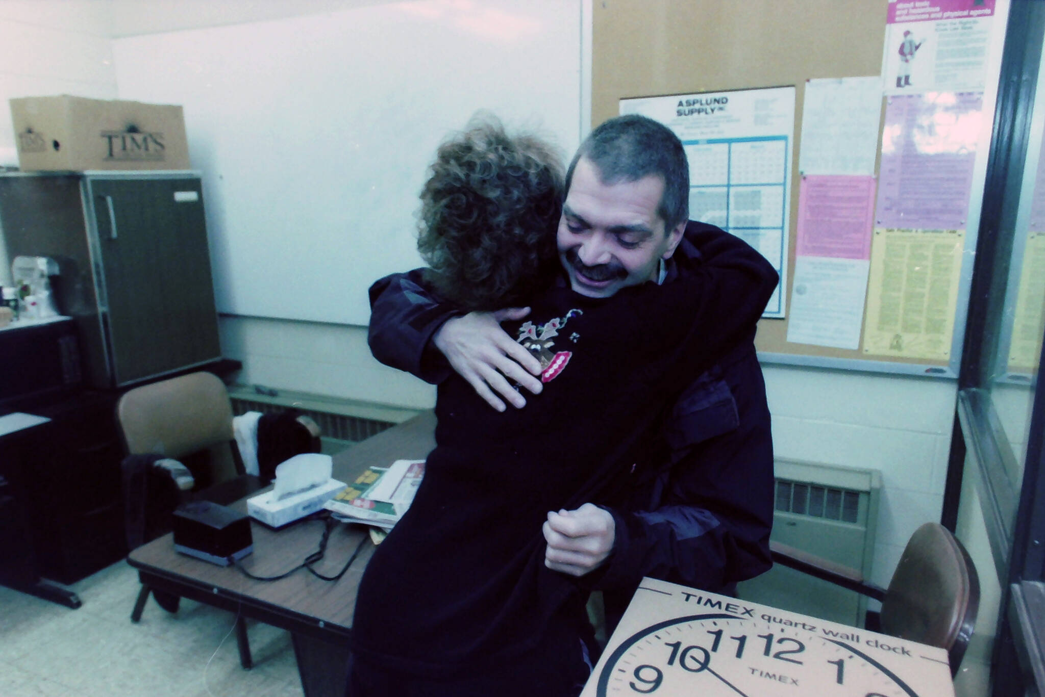Robert Summer is embraced at Kenai Middle School in Kenai, Alaska, in November 2004. (M. Scott Moon/Peninsula Clarion file)