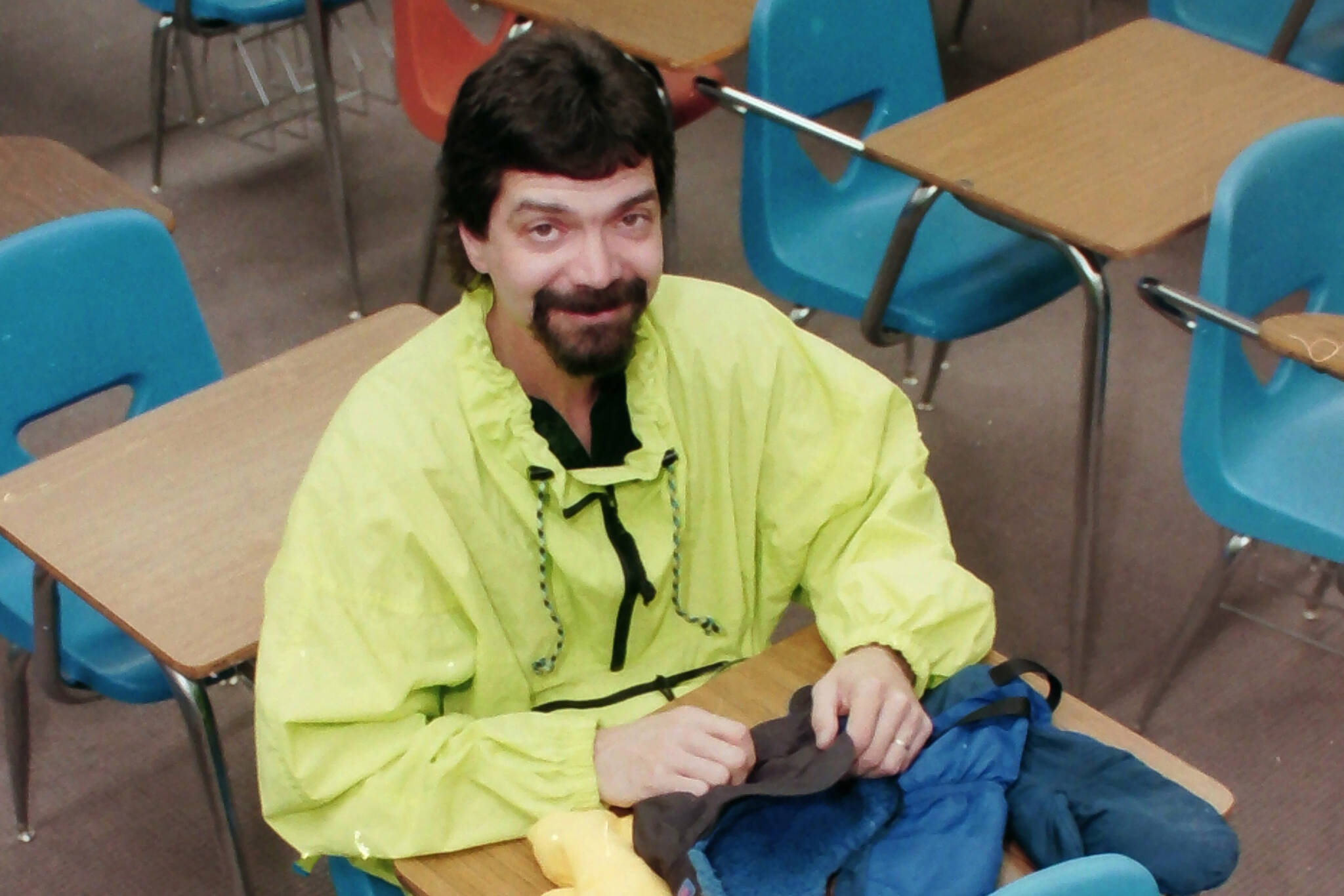 Robert Summer sits at a desk in his classroom at Kenai Middle School in Kenai, Alaska, in April 1997. (M. Scott Moon/Peninsula Clarion)