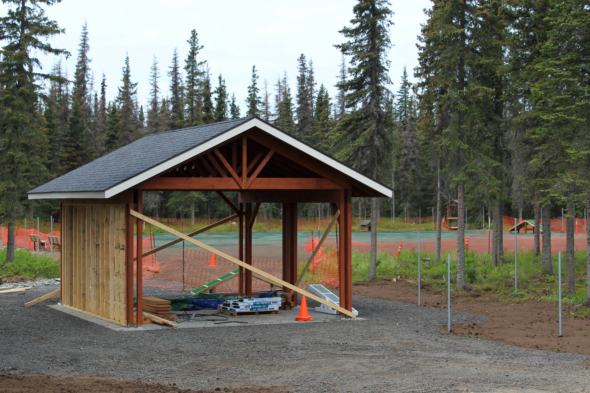 A pavillion under construction marks the entrance to the future Kenai Dog Park on Wednesday, June 14, 2023, in Kenai, Alaska. (Ashlyn O’Hara/Peninsula Clarion)