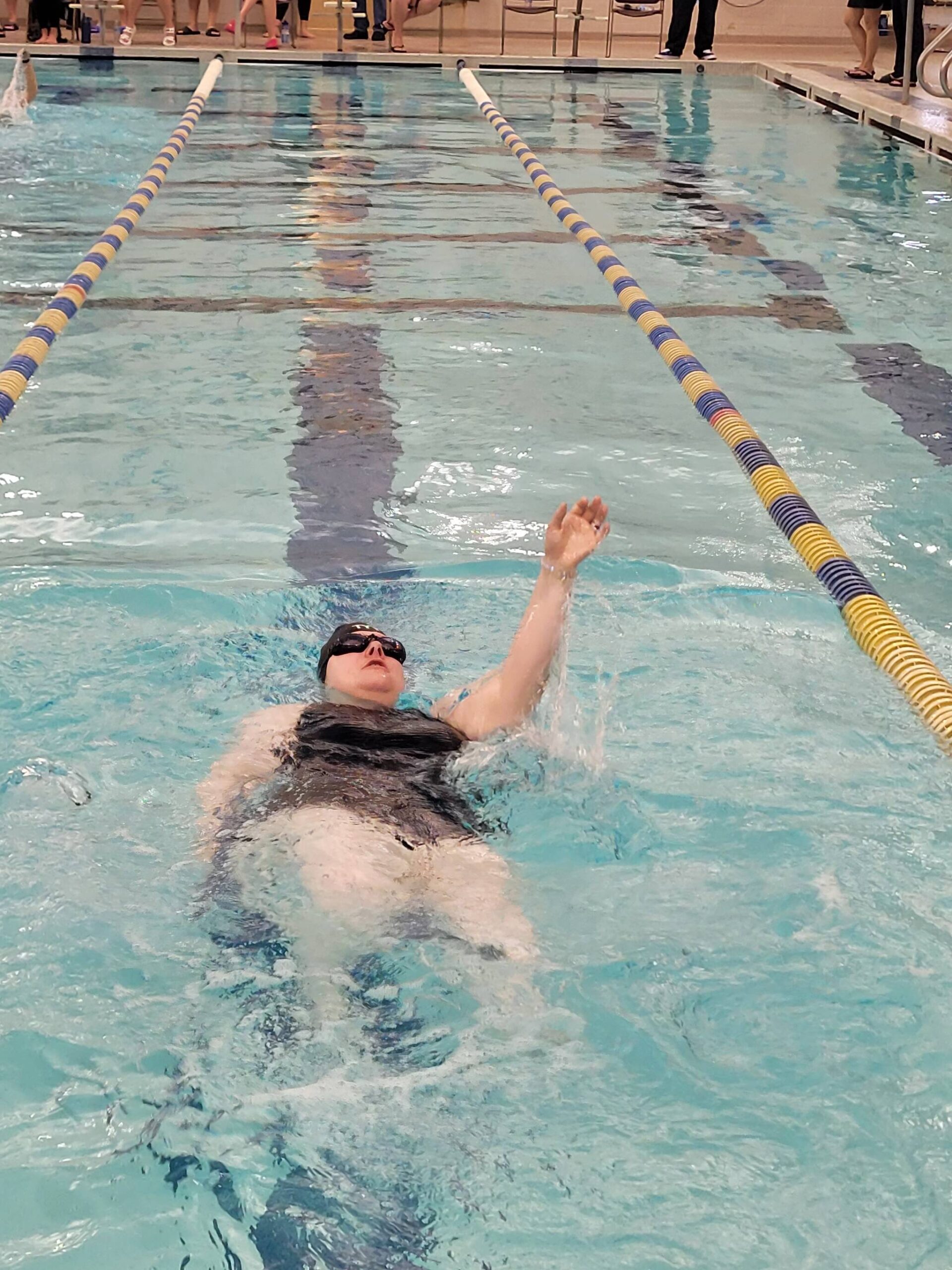 Jess Gilbert swims the 100-meter backstroke at the 2023 Special Olympics Alaska Summer Games at Dimond High School in Anchorage, Alaska. (Photo provided by Special Olympics Alaska Central Peninsula)