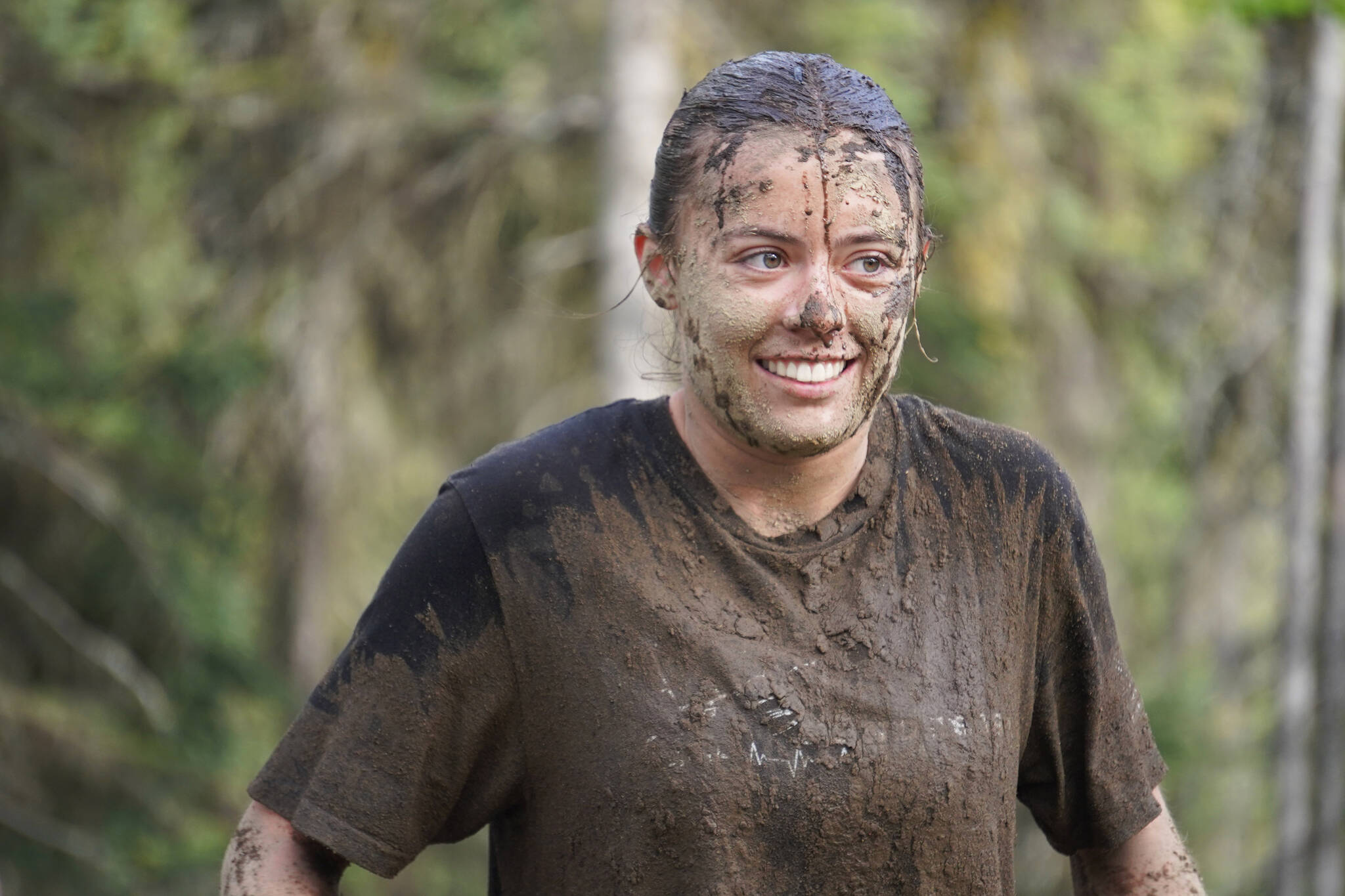Rachel Richardson is named “The Muddiest” at the conclusion of the KDLL Mud Run at Tsalteshi Trails in Soldotna, Alaska, on Friday, June 16, 2023. (Jake Dye/Peninsula Clarion)