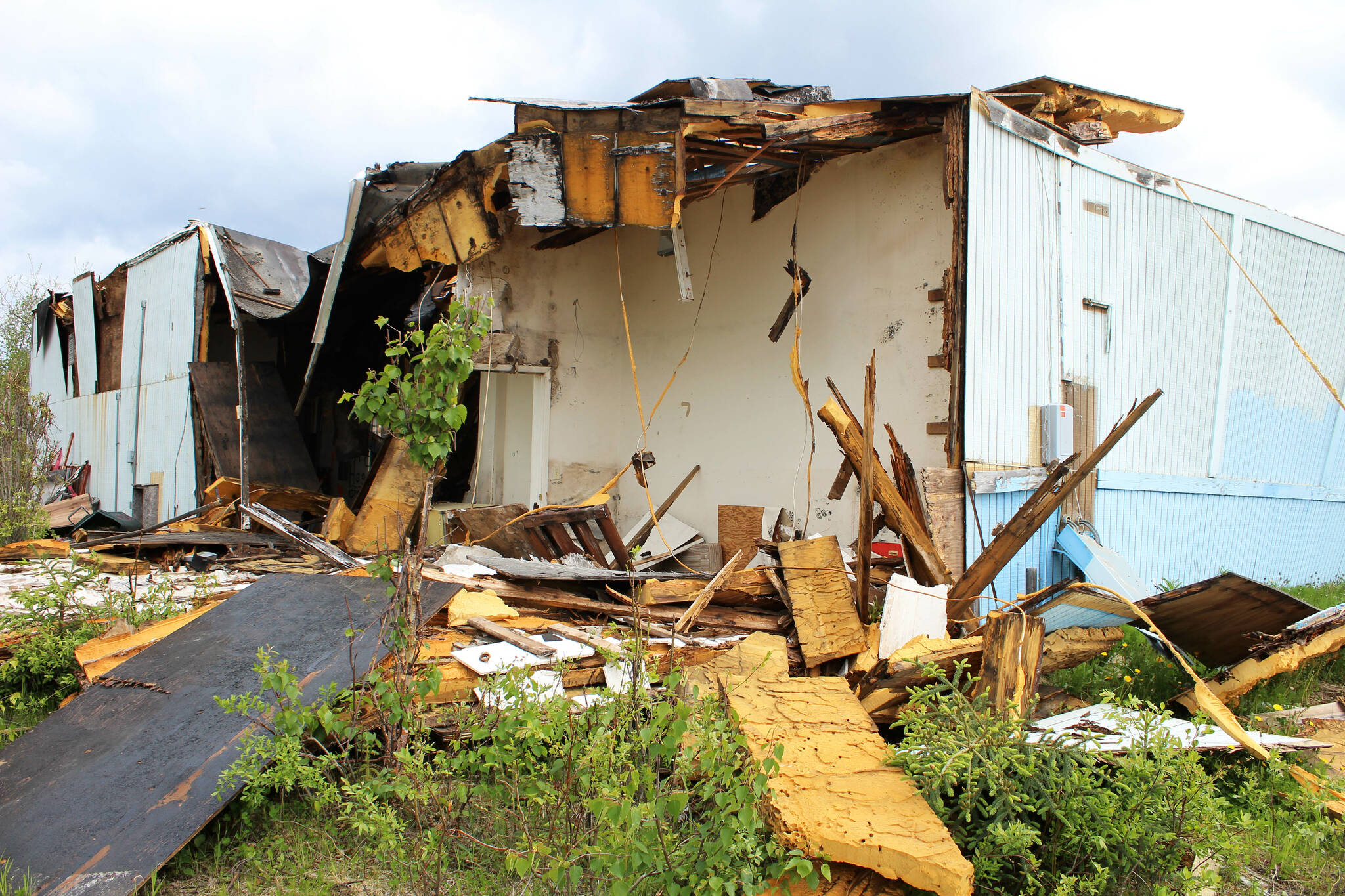 Building materials pile up at the site of the former ZipMart on Wednesday, June 14, 2023, in Sterling, Alaska. (Ashlyn O’Hara/Peninsula Clarion)