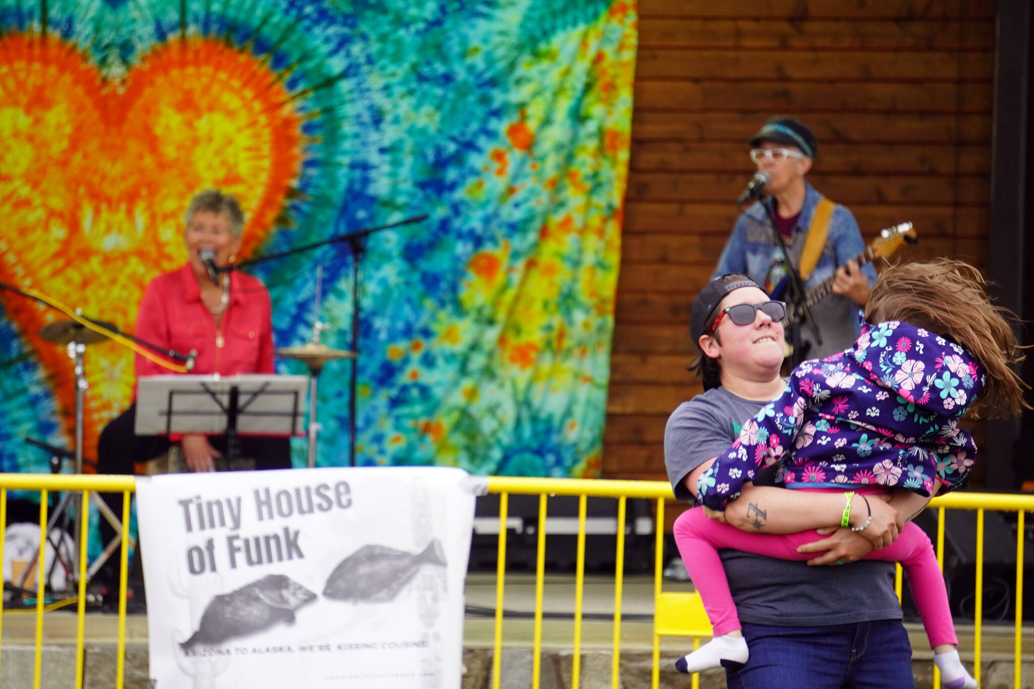 Attendees dance before the stage as Connie Brannock’s Tiny House of Funk performs during the Soldotna Music Series at Soldotna Creek Park in Soldotna, Alaska, on Wednesday, June 21, 2023. (Jake Dye/Peninsula Clarion)