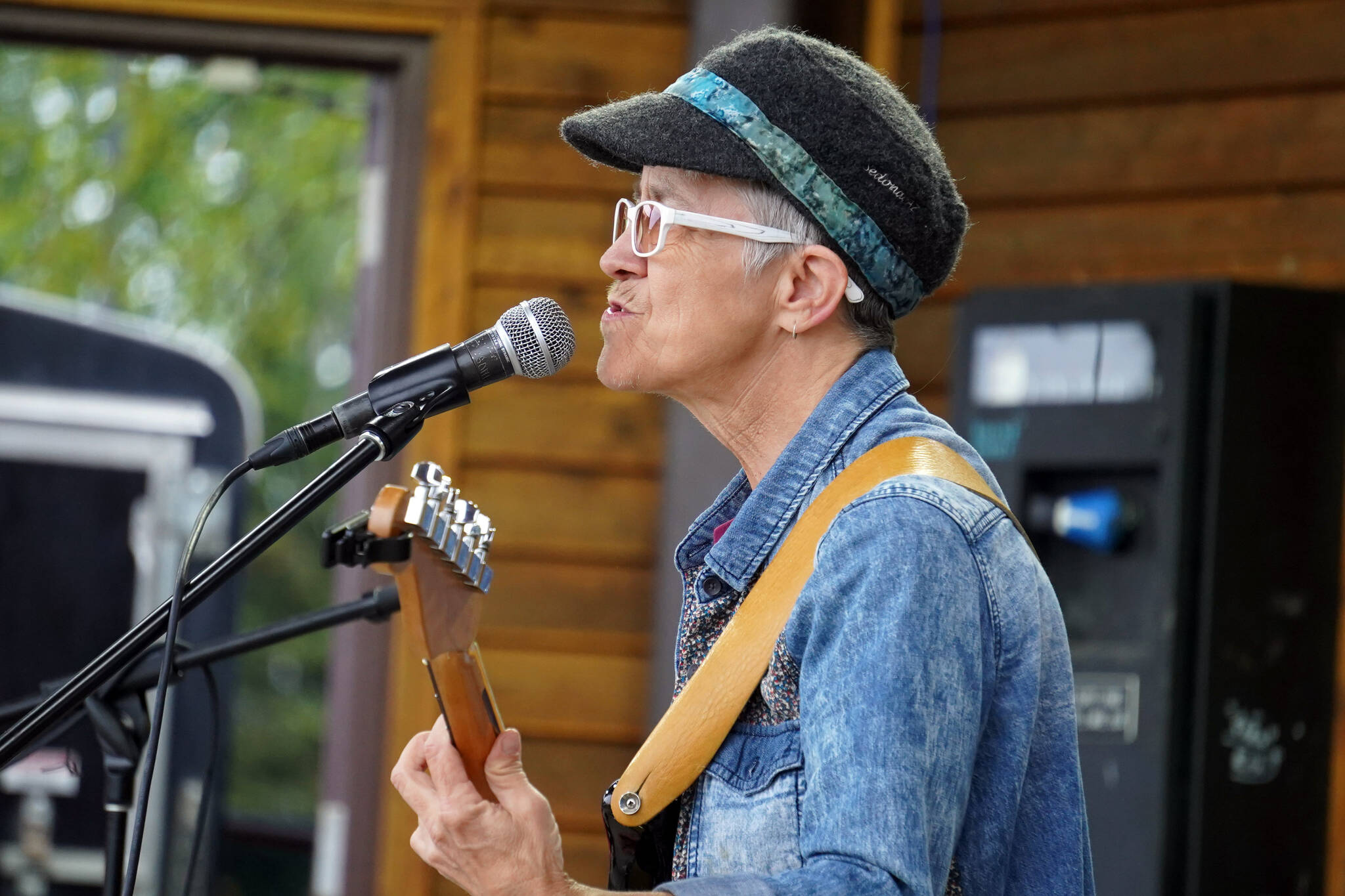Mitzi Cowell, part of Connie Brannock’s Tiny House of Funk, performs during the Soldotna Music Series at Soldotna Creek Park in Soldotna, Alaska, on Wednesday, June 21, 2023. (Jake Dye/Peninsula Clarion)