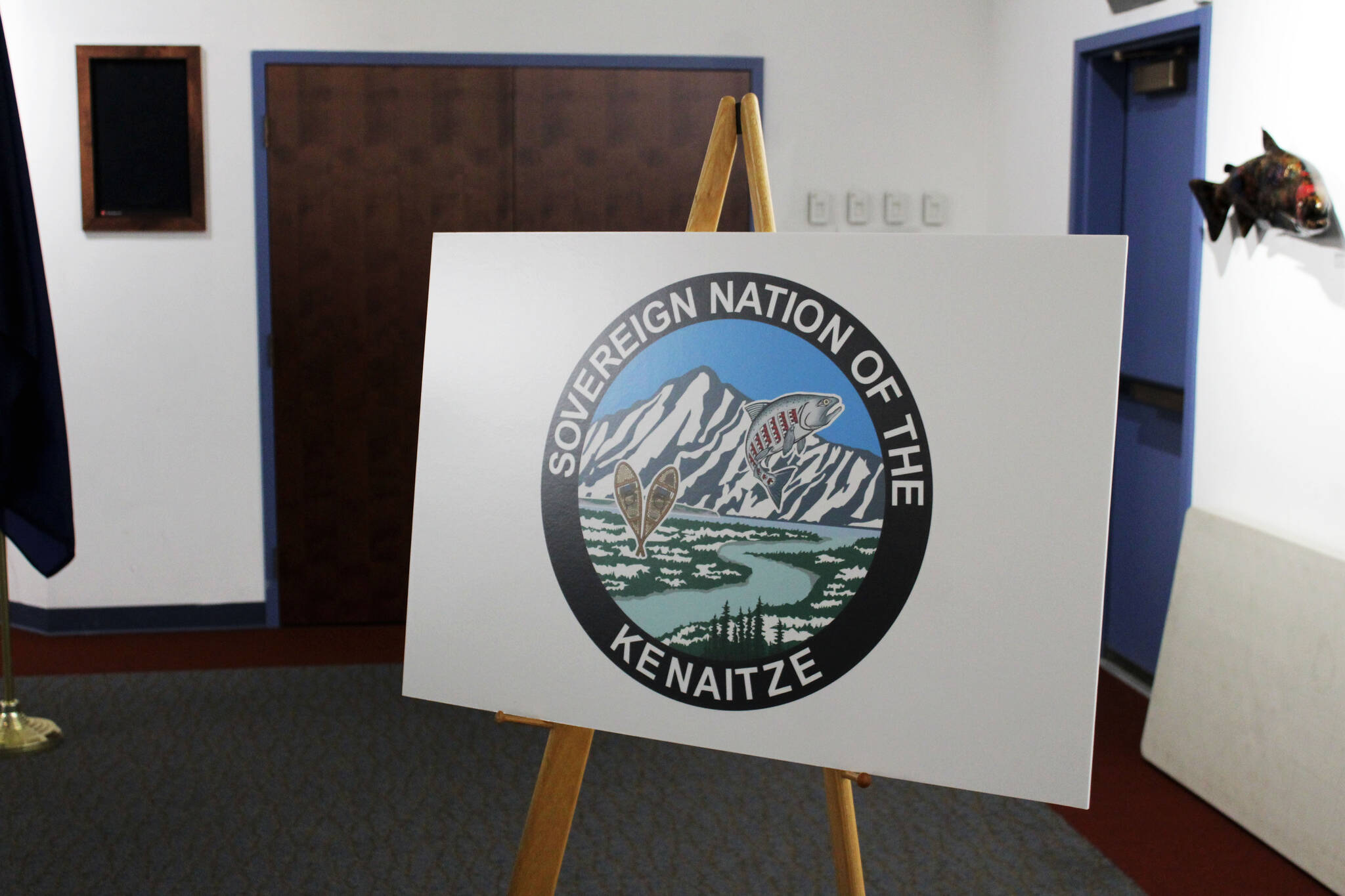 A sign displays the logo of the Kenaitze Indian Tribe at the Kenai Chamber of Commerce on Wednesday, July 7, 2021 in Kenai, Alaska. (Ashlyn O’Hara/Peninsula Clarion)