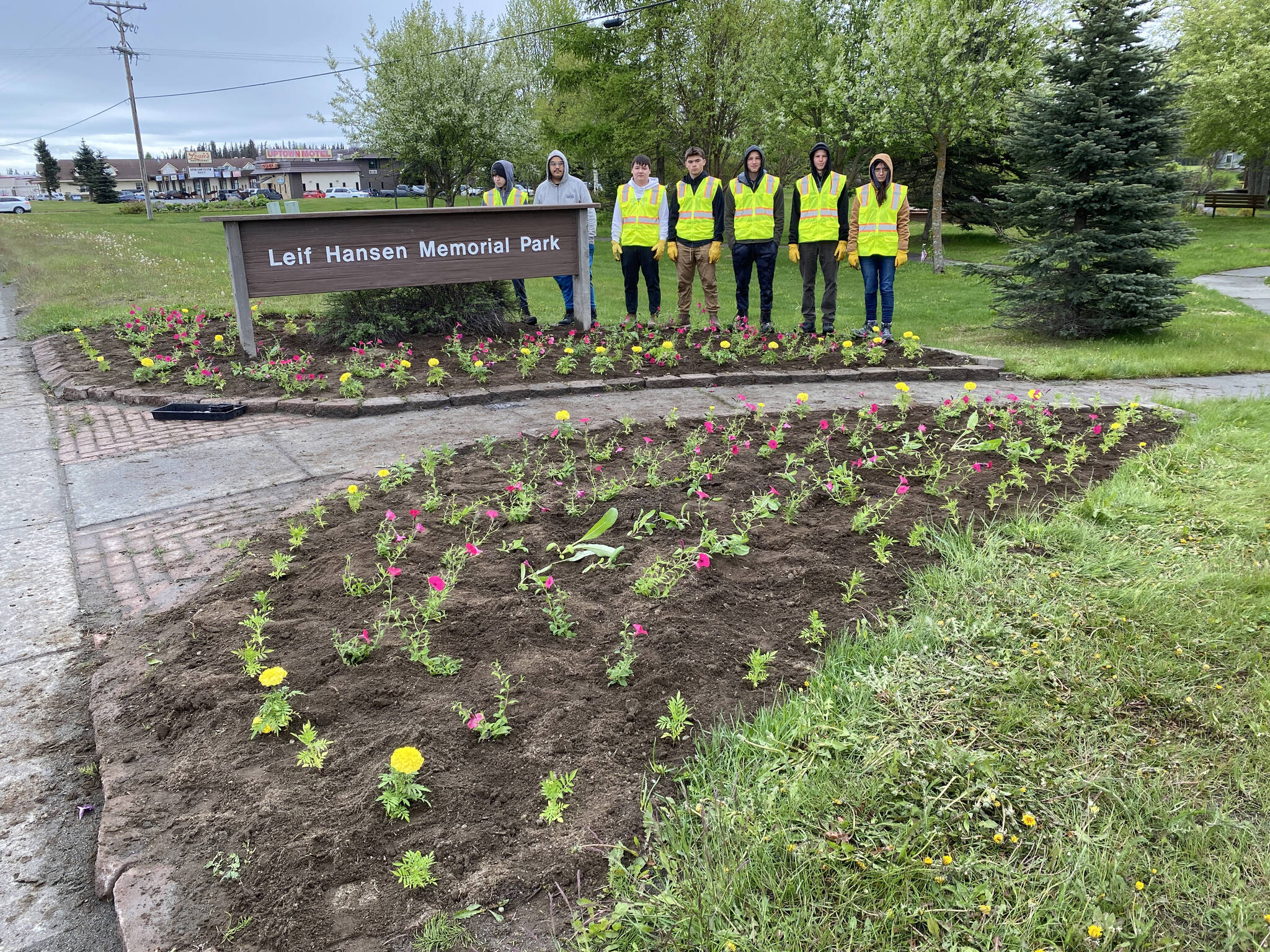 The interns working with Salamatof Tribe Duhdeldiht Youth Services stand with flowers they helped to plant in Leif Hansen Memorial Park (Photo courtesy Michael Bernard)