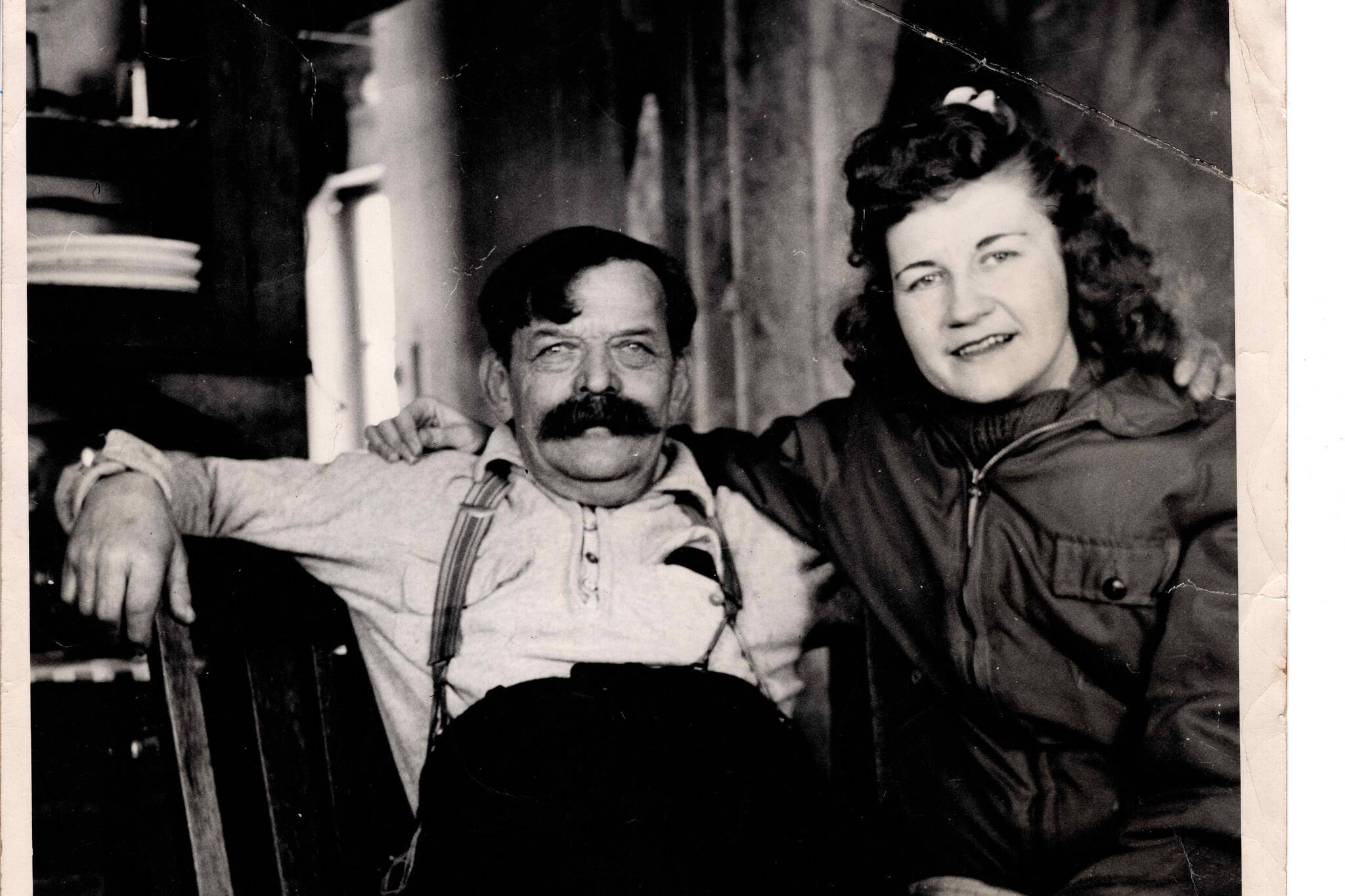 Charles “Windy” Wagner, in his later years, and an unknown woman smile for the camera in Wagner’s Kenai River cabin. (Photo courtesy of the Knackstedt Collection)