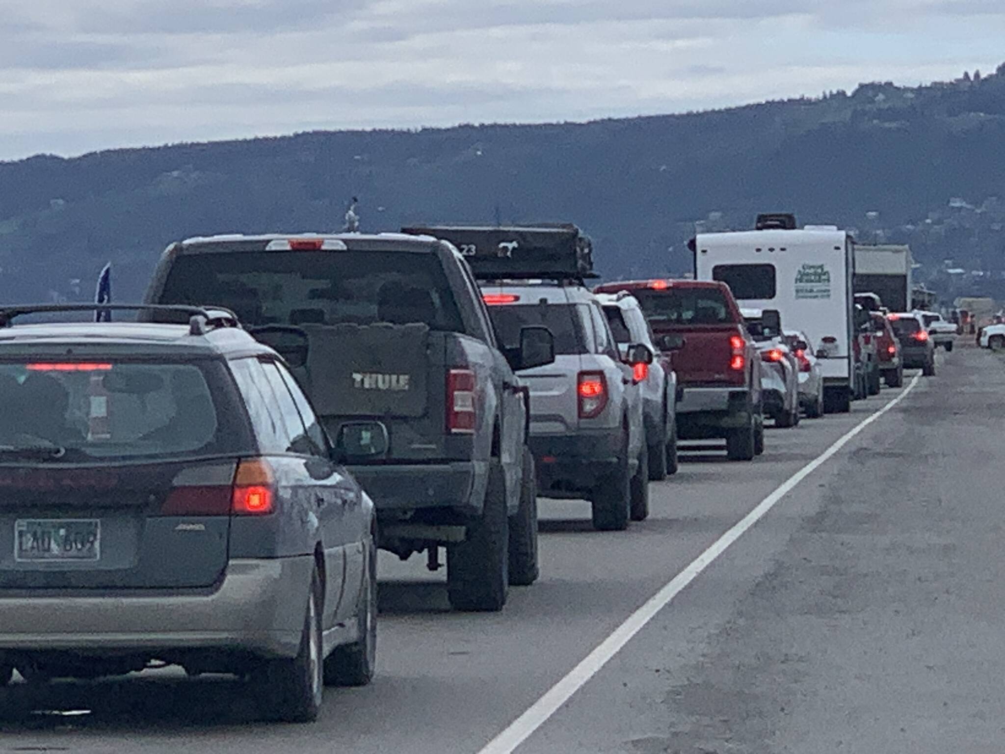 Traffic is backed up on the Homer Spit late Friday afternoon on June 20, 2023, in Homer, Alaska, while Homer Police and Homer Volunteer Fire Department staff respond to a tourist injured when she was hit by a car that veered onto the bike trail. (Photo by Christina Whiting/Special to the Homer News).