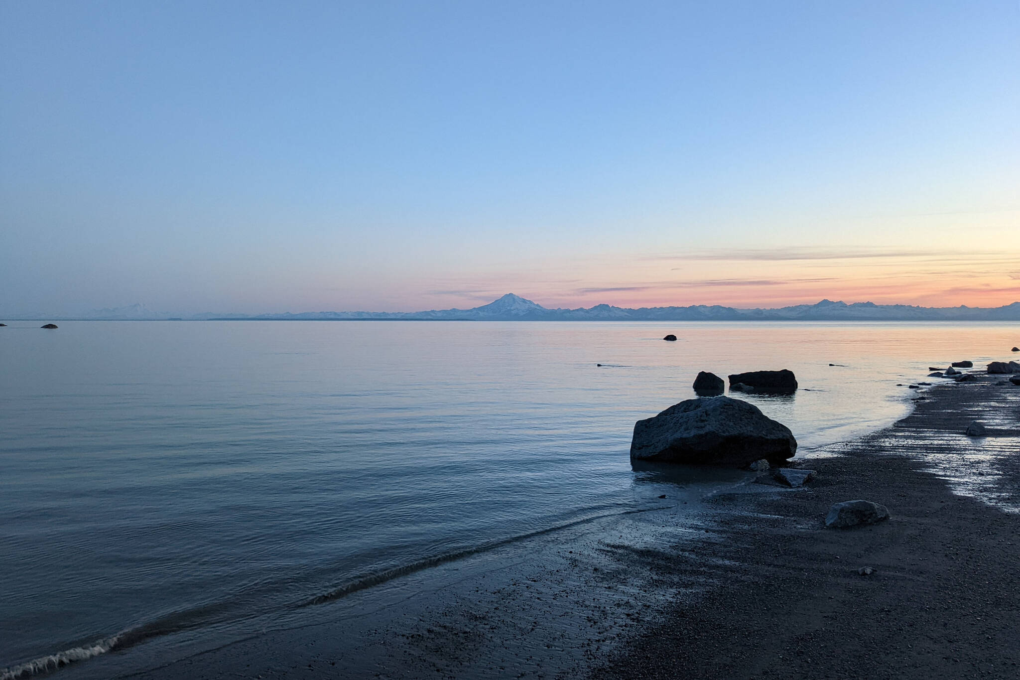 Mount Redoubt can be seen acoss Cook Inlet from North Kenai Beach on Thursday, July 2, 2022. (Photo by Erin Thompson/Peninsula Clarion)