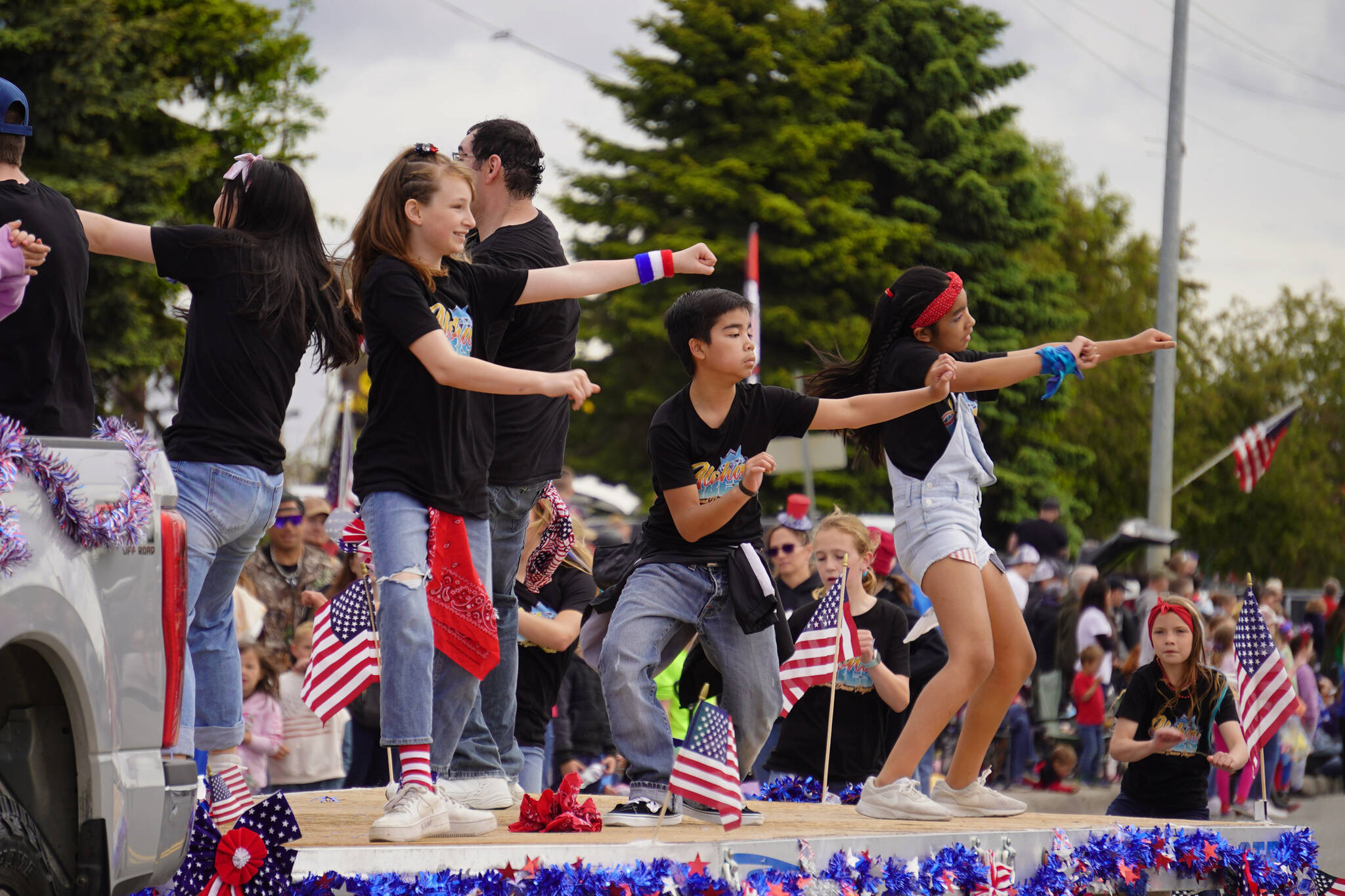 Diamond Dance Project students perform a routine as the Fourth of July Parade moves down the Kenai Spur Highway in Kenai, Alaska on Tuesday, July 4, 2023. (Jake Dye/Peninsula Clarion)