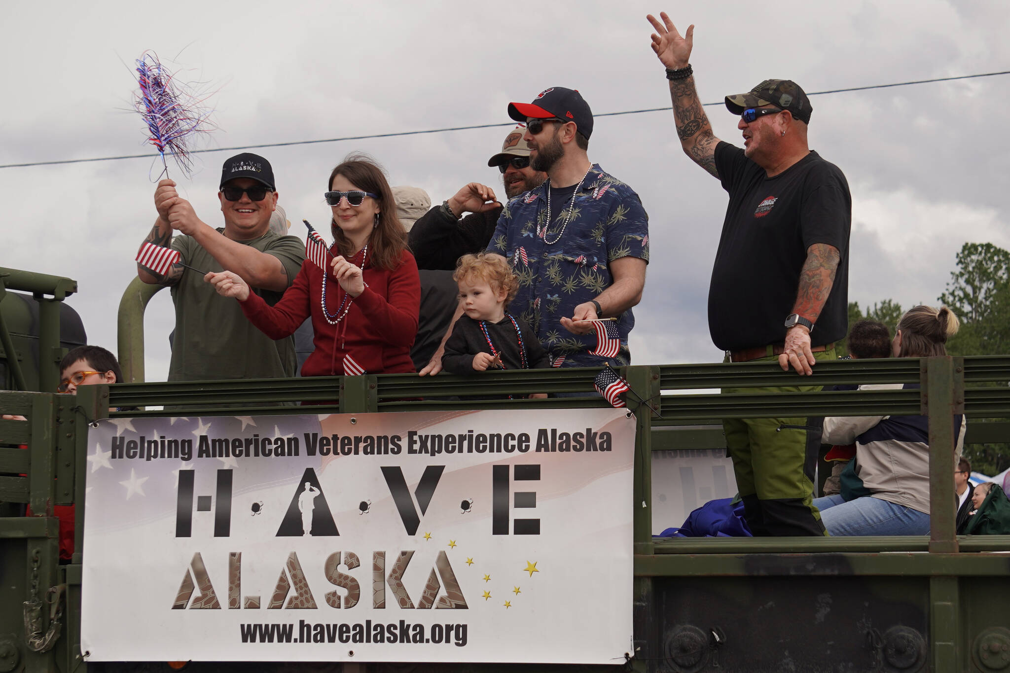 Veterans visiting Alaska as part of HAVE Alaska wave as the Fourth of July Parade moves down the Kenai Spur Highway in Kenai, Alaska on Tuesday, July 4, 2023. (Jake Dye/Peninsula Clarion)