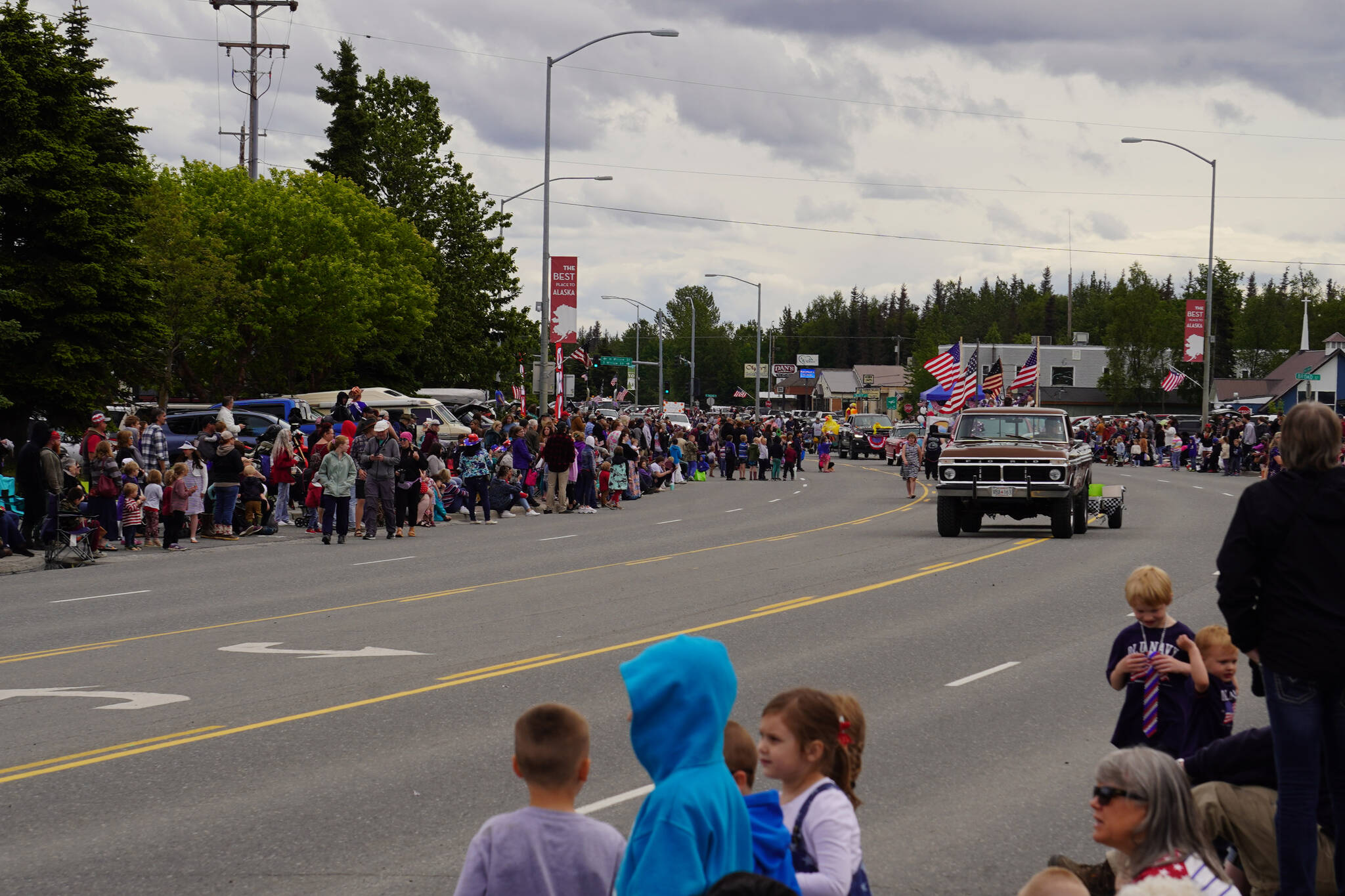 Hundreds line sidewalks as the Fourth of July Parade moves down the Kenai Spur Highway in Kenai, Alaska on Tuesday, July 4, 2023. (Jake Dye/Peninsula Clarion)