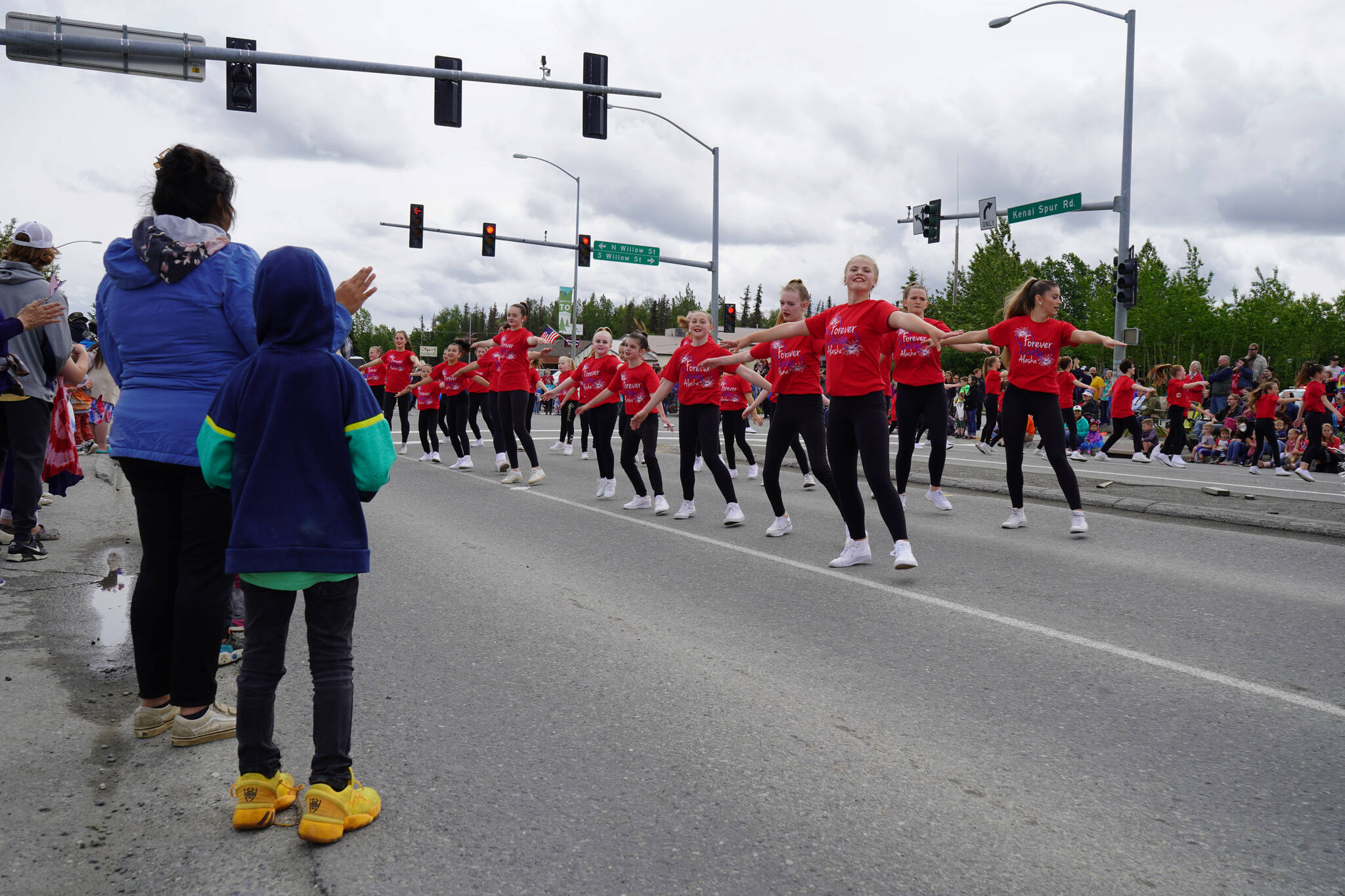 Forever Dance students perform a routine as the Fourth of July Parade moves down the Kenai Spur Highway in Kenai, Alaska on Tuesday, July 4, 2023. (Jake Dye/Peninsula Clarion)