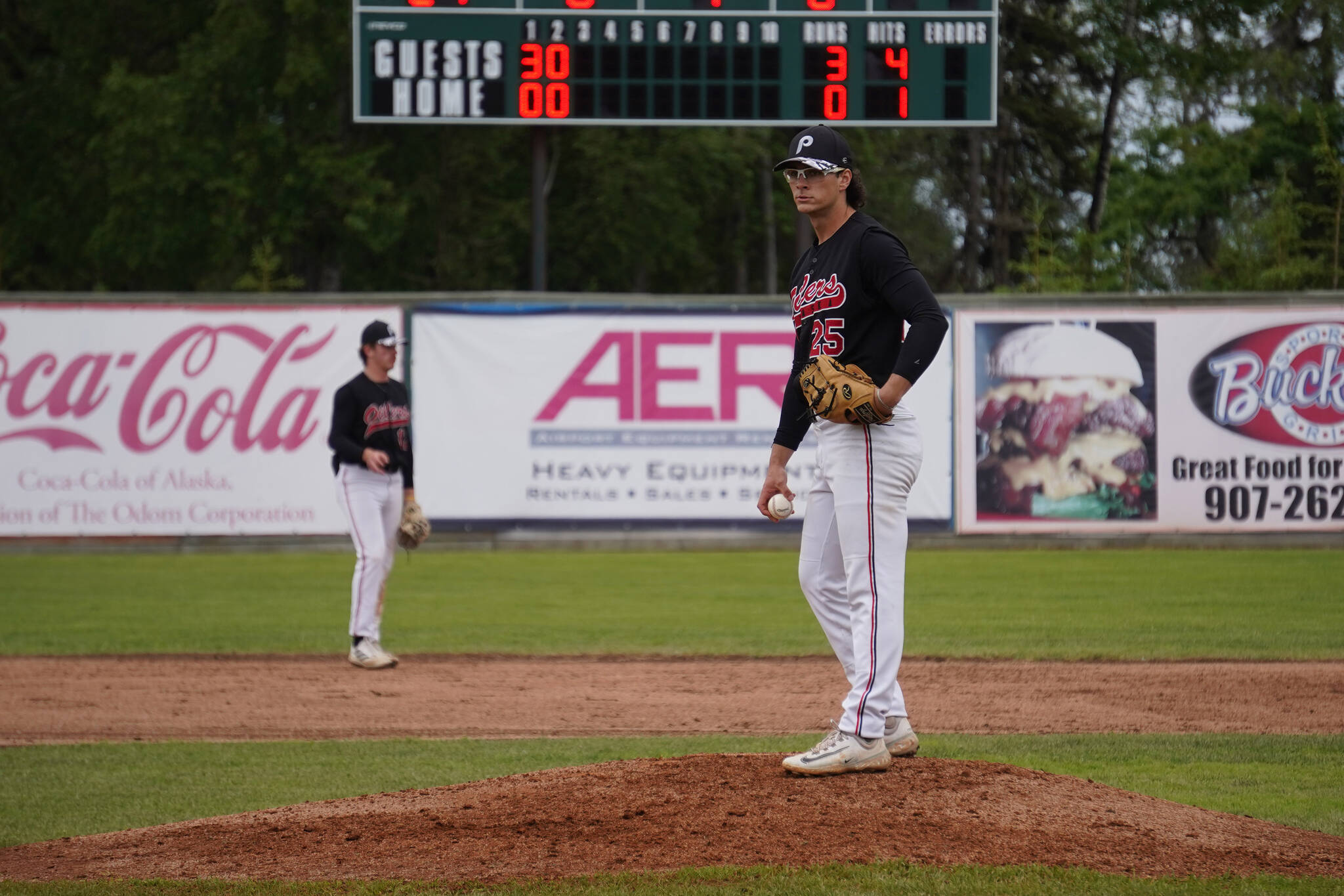 Ryan Brown readies a ball during a game between the Peninsula Oilers and the Mat-Su Miners on Tuesday, July 4, 2023, at Coral Seymour Memorial Park in Kenai, Alaska. (Jake Dye/Peninsula Clarion)