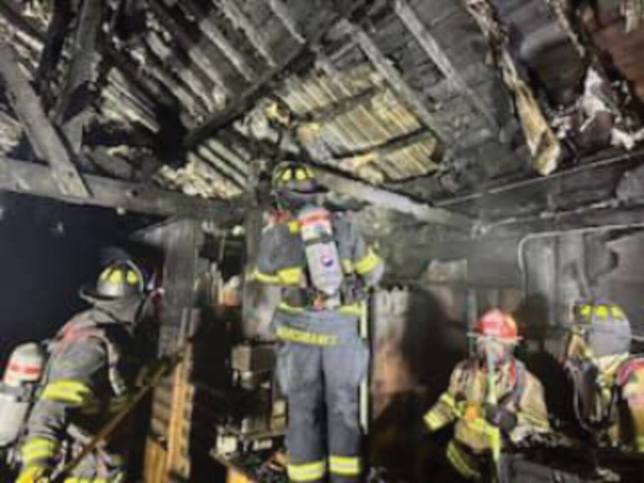 Kachemak Emergency Services and Homer Volunteer Fire Department personnel work to extinguish a fire inside the Fritz Creek General Store east of Homer on East End Road, early Thursday morning on July 6, 2023 in Fritz Creek, Alaska. Photo by Mark Kirko