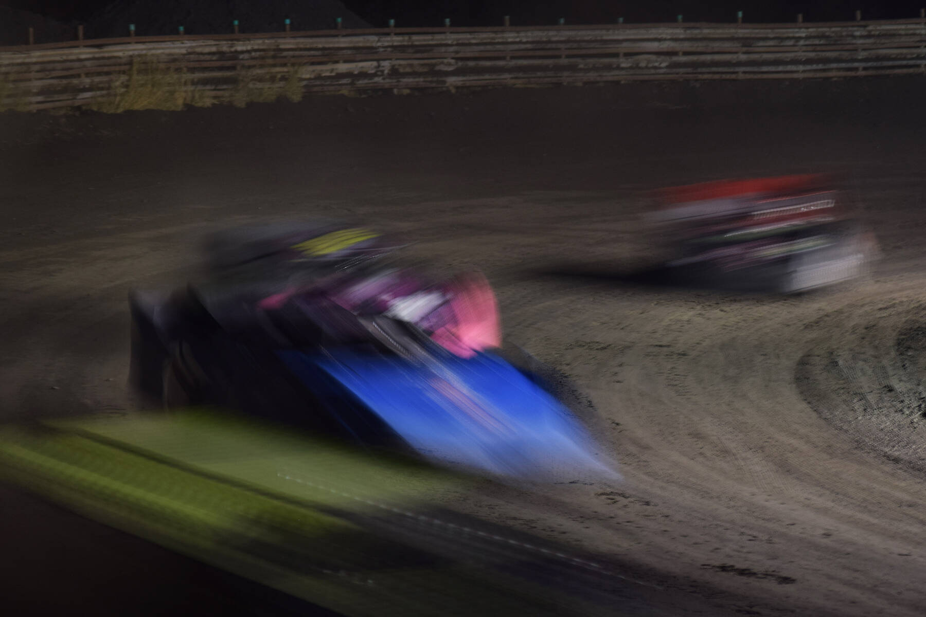 The field of Late Models slide through a turn Friday, Sept. 6, 2019, at Twin City Raceway in Kenai, Alaska. (Photo by Joey Klecka/Peninsula Clarion)