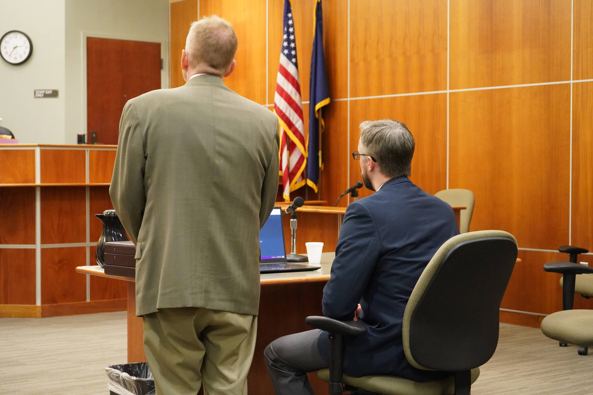 Lawyer Eric Derleth and his client Nathan Erfurth, a former Soldotna High School teacher accused of sexually abusing one of his students, submit a not guilty plea at an arraignment hearing on Tuesday, July 11, 2023, at the Kenai Courthouse in Kenai, Alaska. (Jake Dye/Peninsula Clarion)