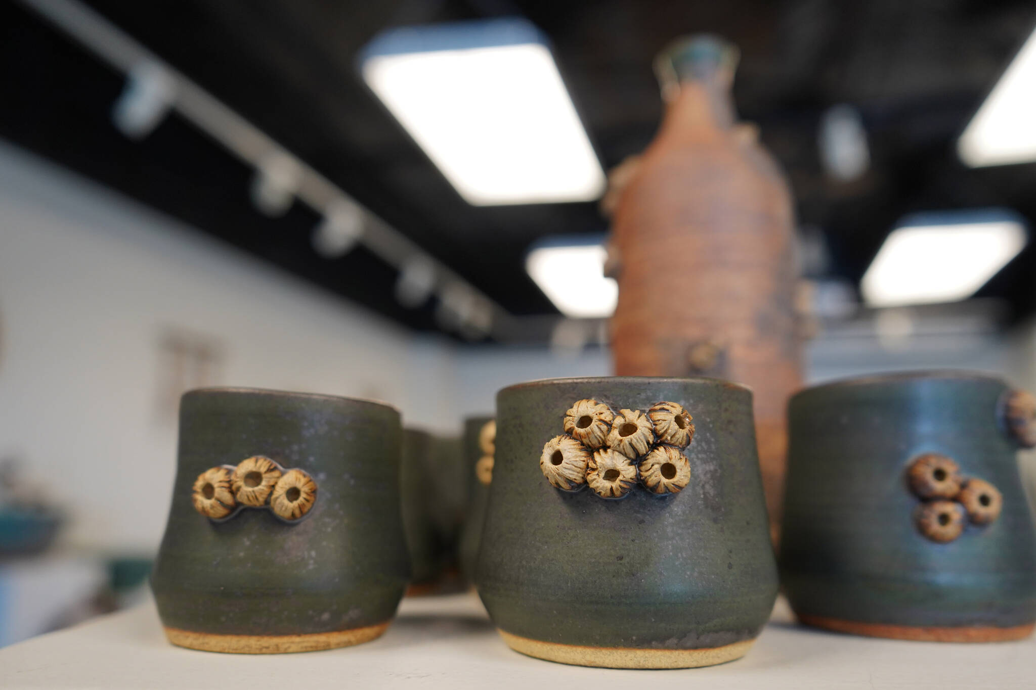 “Barnacle Bob’s Bottle with Cups,” by Shannon Olds, is seen as part of Clay on Display at the Kenai Art Center in Kenai, Alaska, on Wednesday, July 12, 2023. (Jake Dye/Peninsula Clarion)