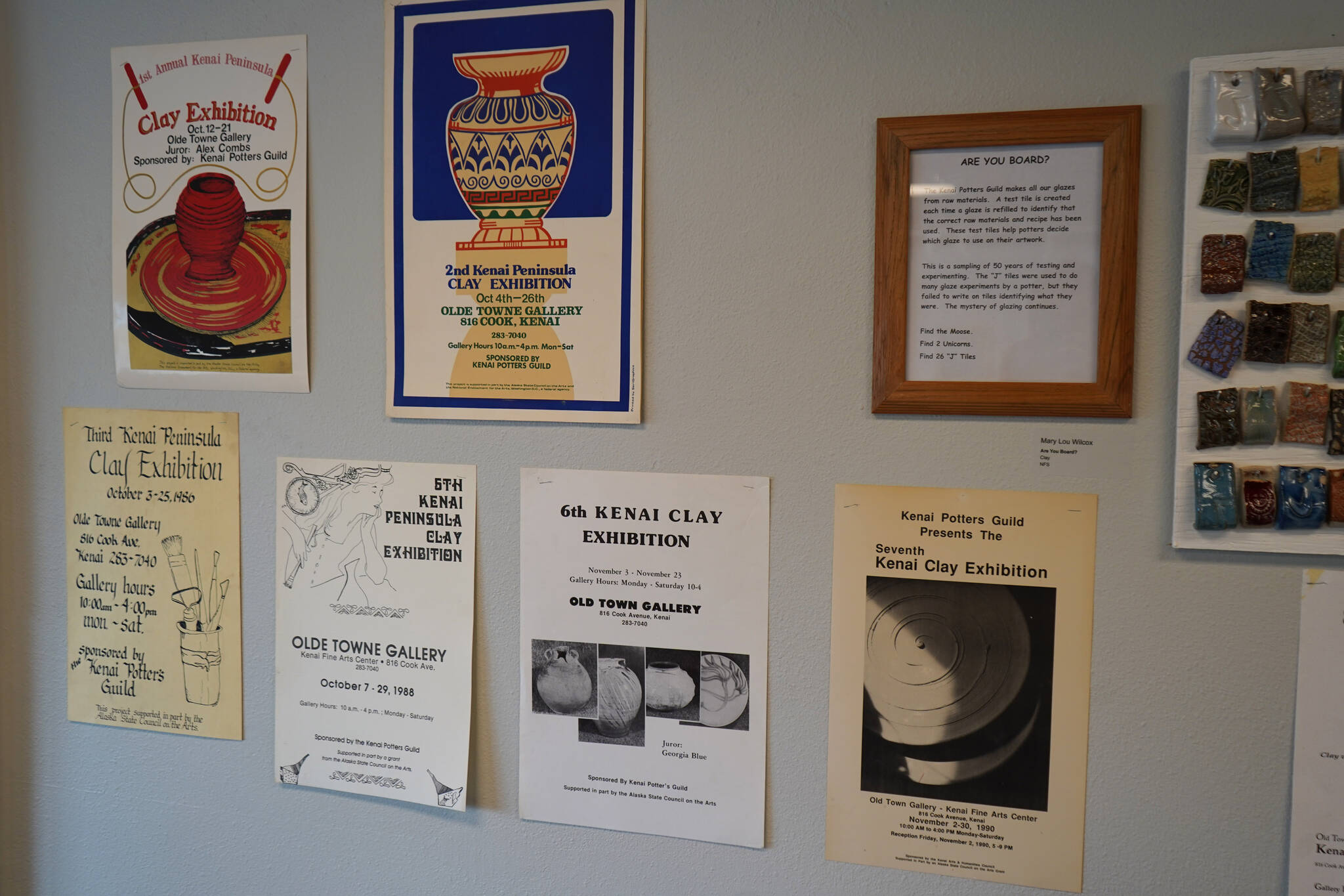 A series of posters of previous Kenai Peninsula Clay Exhibitions that date back to the 1980s are seen as part of Clay on Display at the Kenai Art Center in Kenai, Alaska, on Wednesday, July 12, 2023. (Jake Dye/Peninsula Clarion)