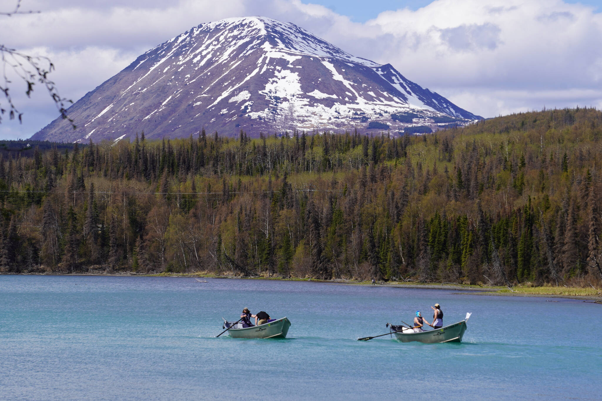 Contestants race down the Kenai River during the 16th Annual Cooper Landing Drift Boat Regata near the Eagle Landing Resort in Cooper Landing, Alaska on Saturday, May 20, 2023. (Jake Dye/Peninsula Clarion)