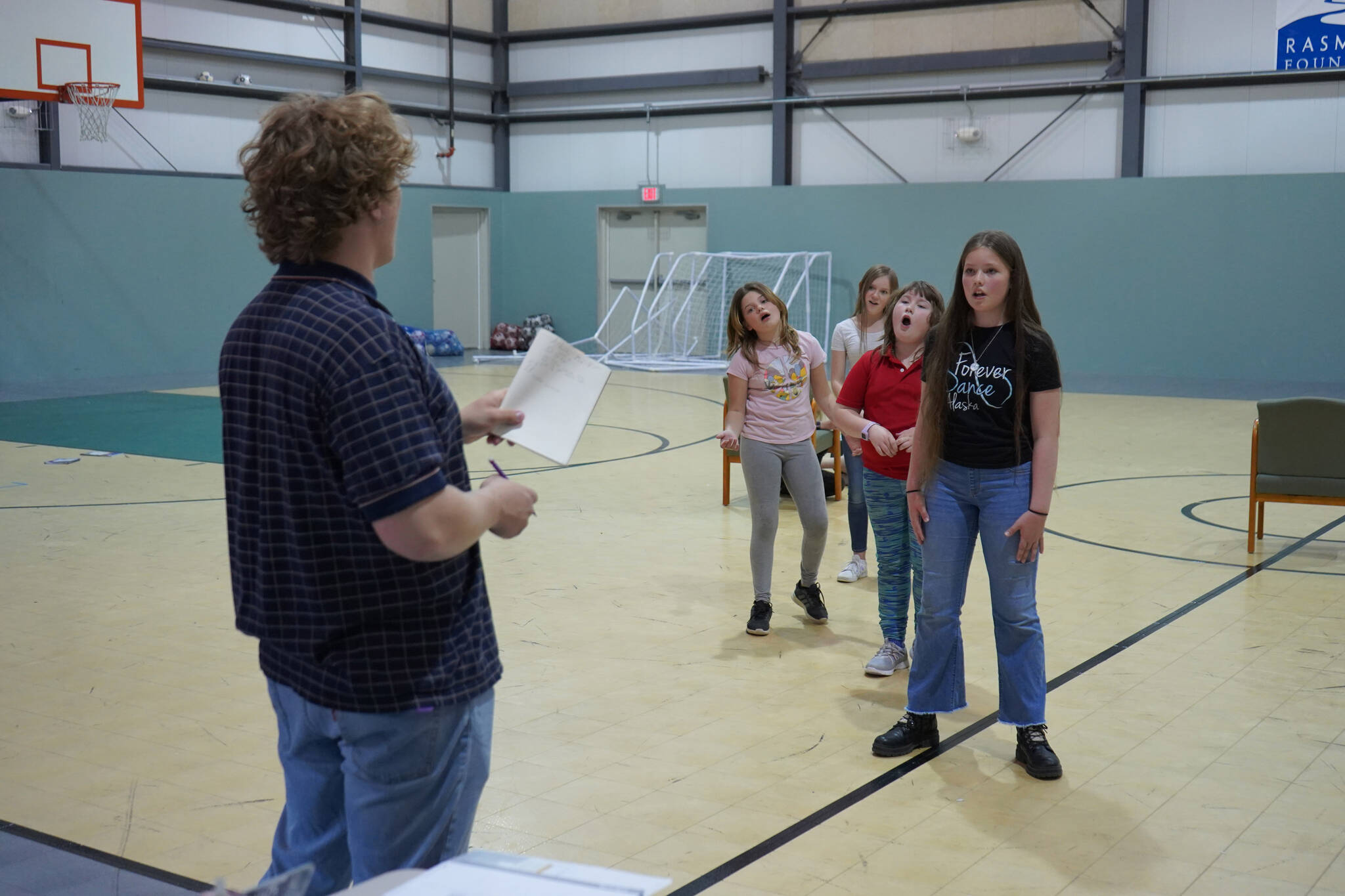 Cooper Kelley directs a rehersal of “The Aristocats Kids” during a Triumvirate Theatre drama camp on Wednesday, July 19, 2023 at the Boys and Girls Club of the Kenai Peninsula Main Office in Kenai, Alaska. (Jake Dye/Peninsula Clarion)