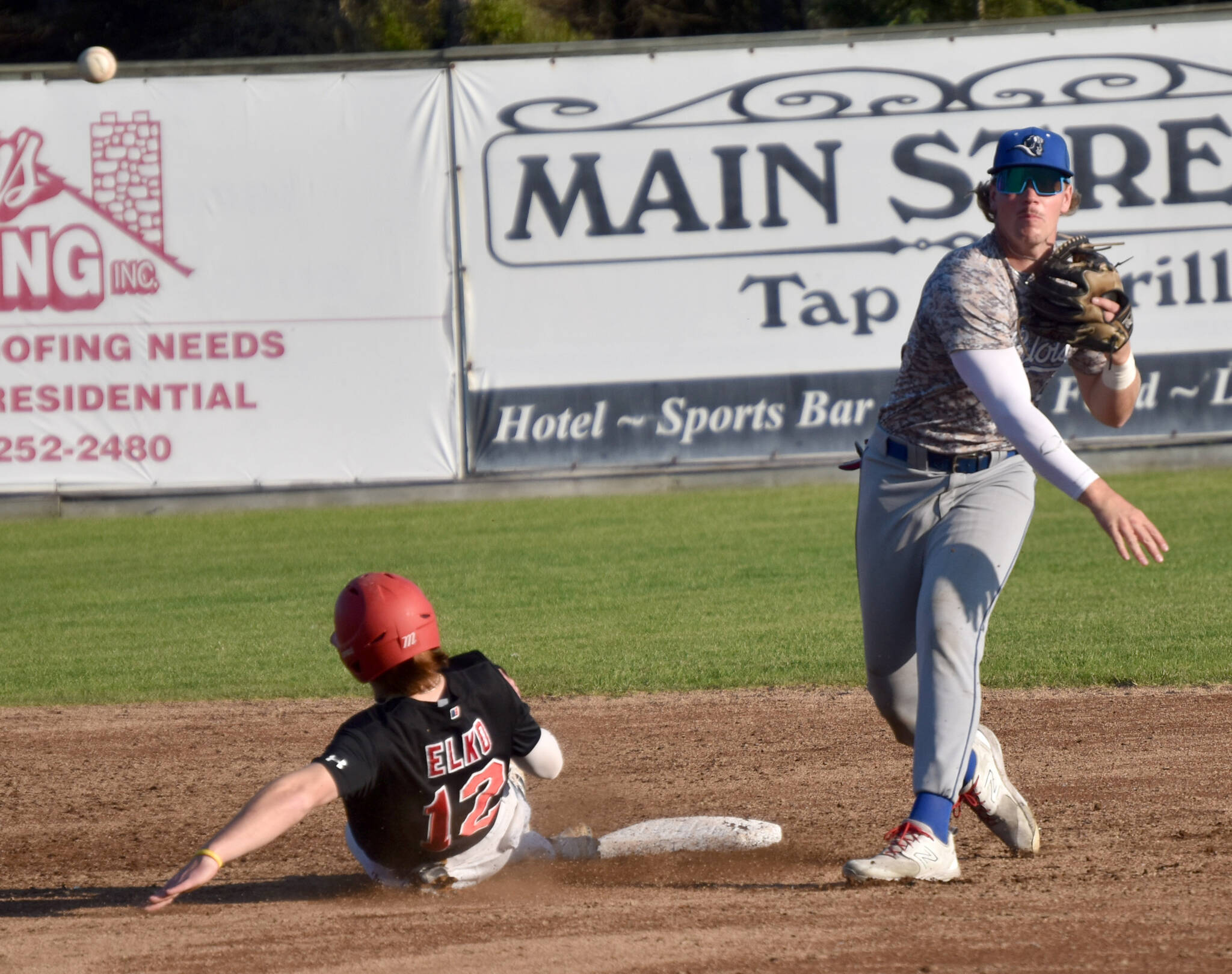 Shaun Montoya of the Anchorage Glacier Pilots turns a double play in front of Michael Elko of the Peninsula Oilers on Saturday, July 22, 2023, at Coral Seymour Memorial Park in Kenai, Alaska. (Photo by Jeff Helminiak/Peninsula Clarion)