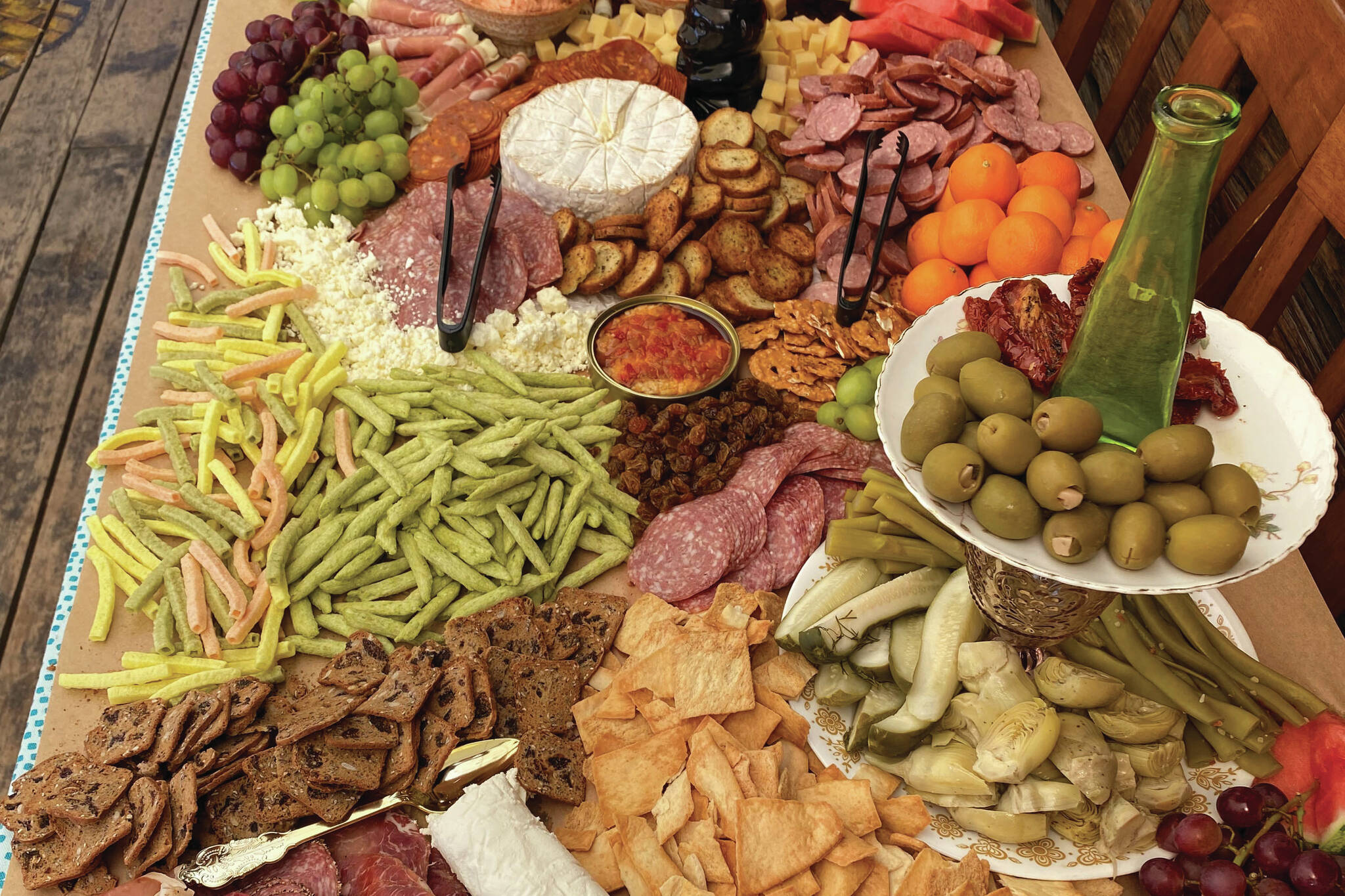 A grazing board, also known as a charcuterie board, is prepared Saturday, July 22, 2023, in Kenai, Alaska. (Photo by Tressa Dale/Peninsula Clarion)