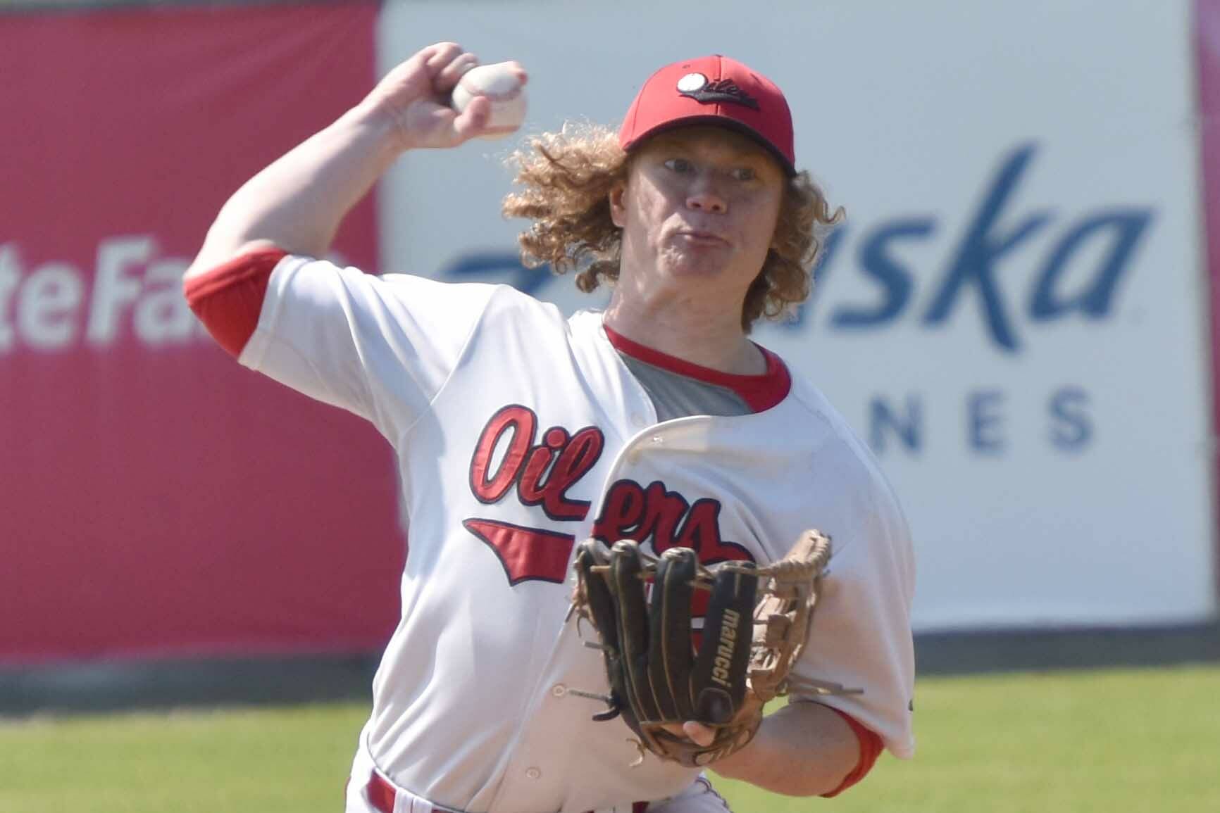 Mose Hayes of the Peninsula Oilers delivers to the Anchorage Glacier Pilots on Sunday, July 23, 2023, at Coral Seymour Memorial Park in Kenai, Alaska. (Photo by Jeff Helminiak/Peninsula Clarion)