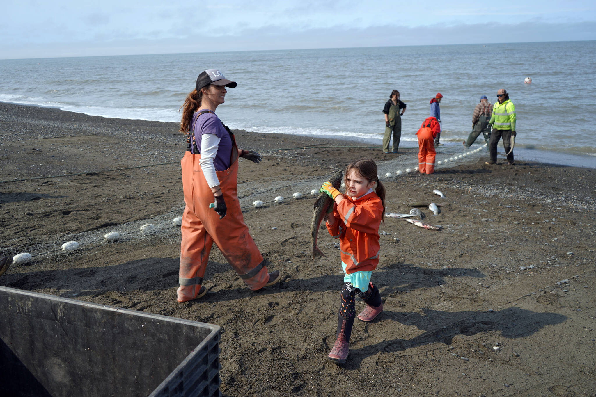 Carrie Hollier and Carmen Hollier collect caught sockeye salmon at a test site for selective harvest setnet gear in Kenai, Alaska, on Tuesday, July 25, 2023. (Jake Dye/Peninsula Clarion)