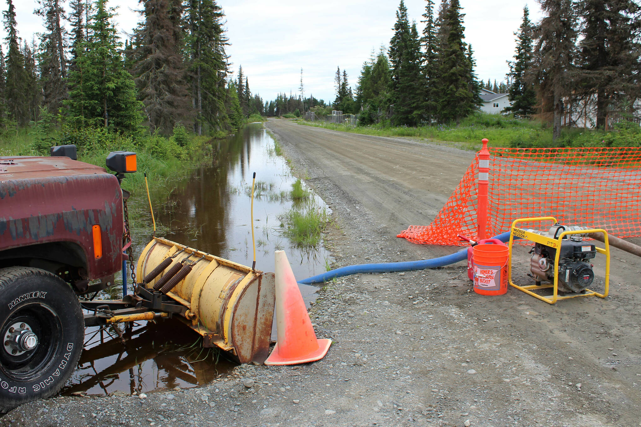 A canal full of water terminates on Eastway R. on Friday, July 21, 2023 near Kenai, Alaska. (Ashlyn O’Hara/Peninsula Clarion)
