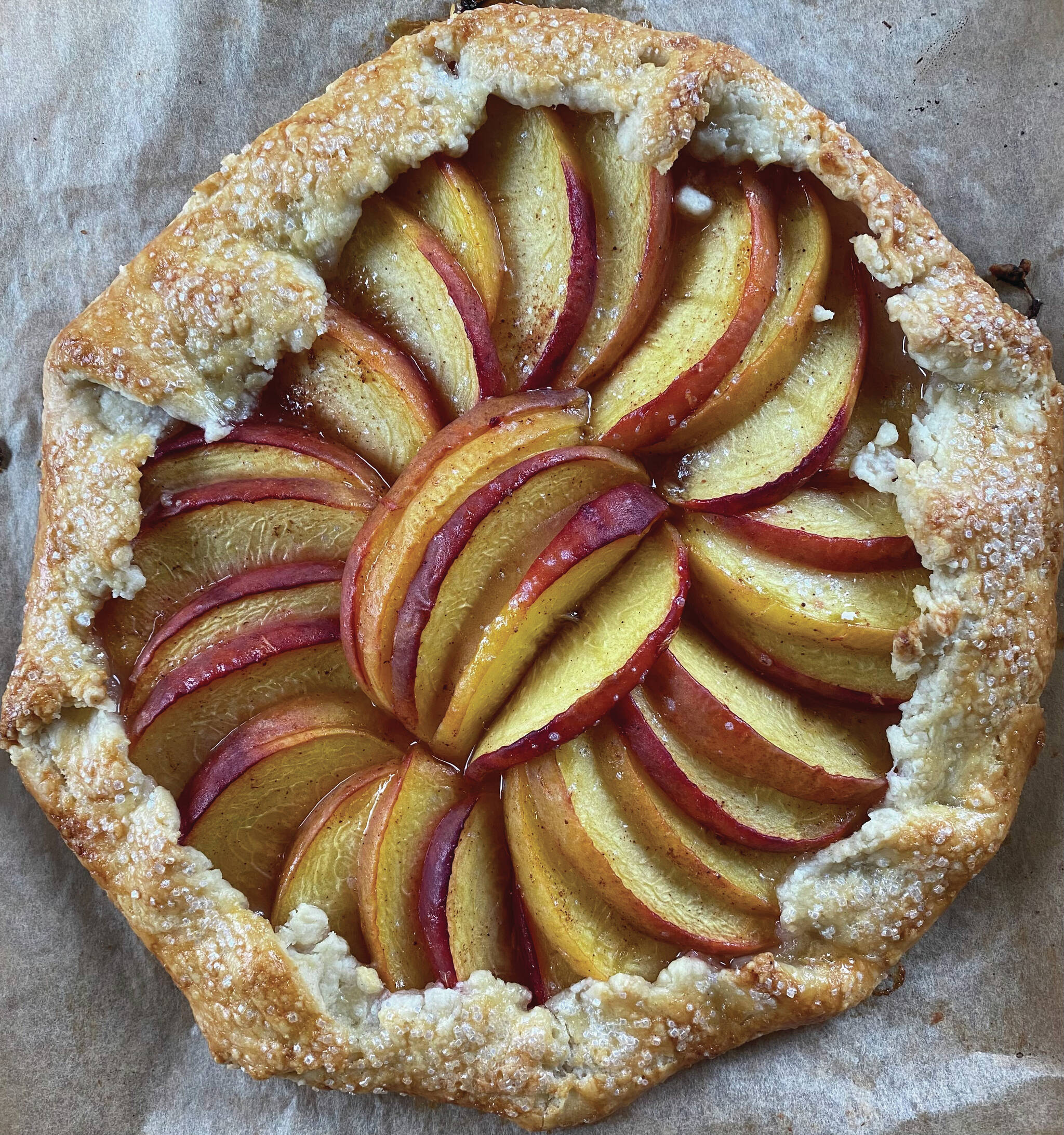 Photo by Tressa Dale/Peninsula Clarion
Fresh ripe peaches are wrapped in a buttery crust in this peach galette recipe.