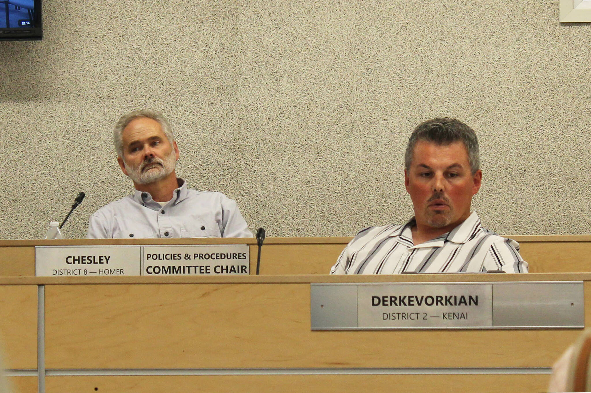 Assembly members Lane Chesley (left) and Richard Derkevorkian (right) participate in a borough assembly meeting on Tuesday, Aug. 1, 2023, in Soldotna, Alaska. (Ashlyn O’Haara/Peninsula Clarion)