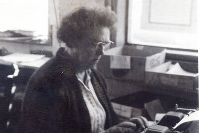 Mable Smith pecks away at her typewriter in the Cheechako News office in Ridgeway, circa mid-1960s. (Cheechako News photo)