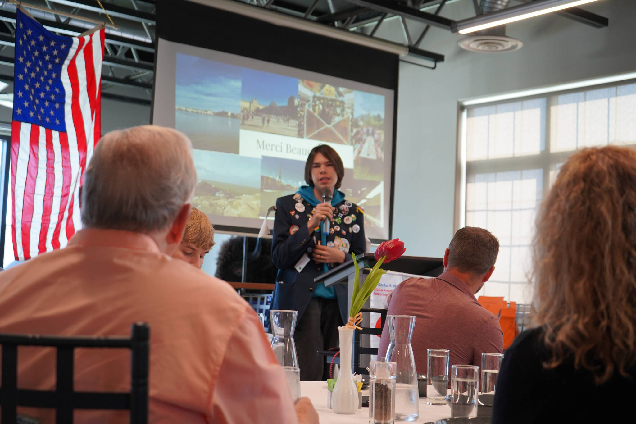 Thomas Smith, a high school student from Kenai who recently completed a year-long exchange program in France, speaks to the Soldotna Rotary Club about his experience at Addie Camp in Soldotna, Alaska, on Thursday, Aug. 3, 2023. (Jake Dye/Peninsula Clarion)