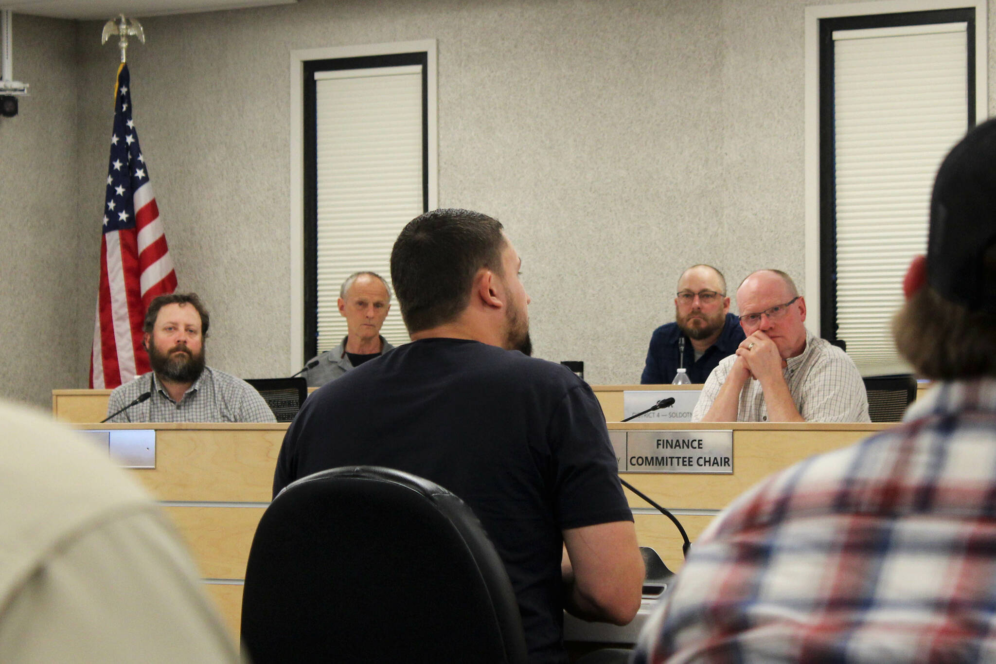 Outlaw Body and Paint’s Wesley Jackson, center, testifies before the Kenai Peninsula Borough Assembly about the affects of calcium chloride brine on vehicles he treats during a meeting on Tuesday, Aug. 2, 2023, in Soldotna, Alaska. (Ashlyn O’Hara/Peninsula Clarion)