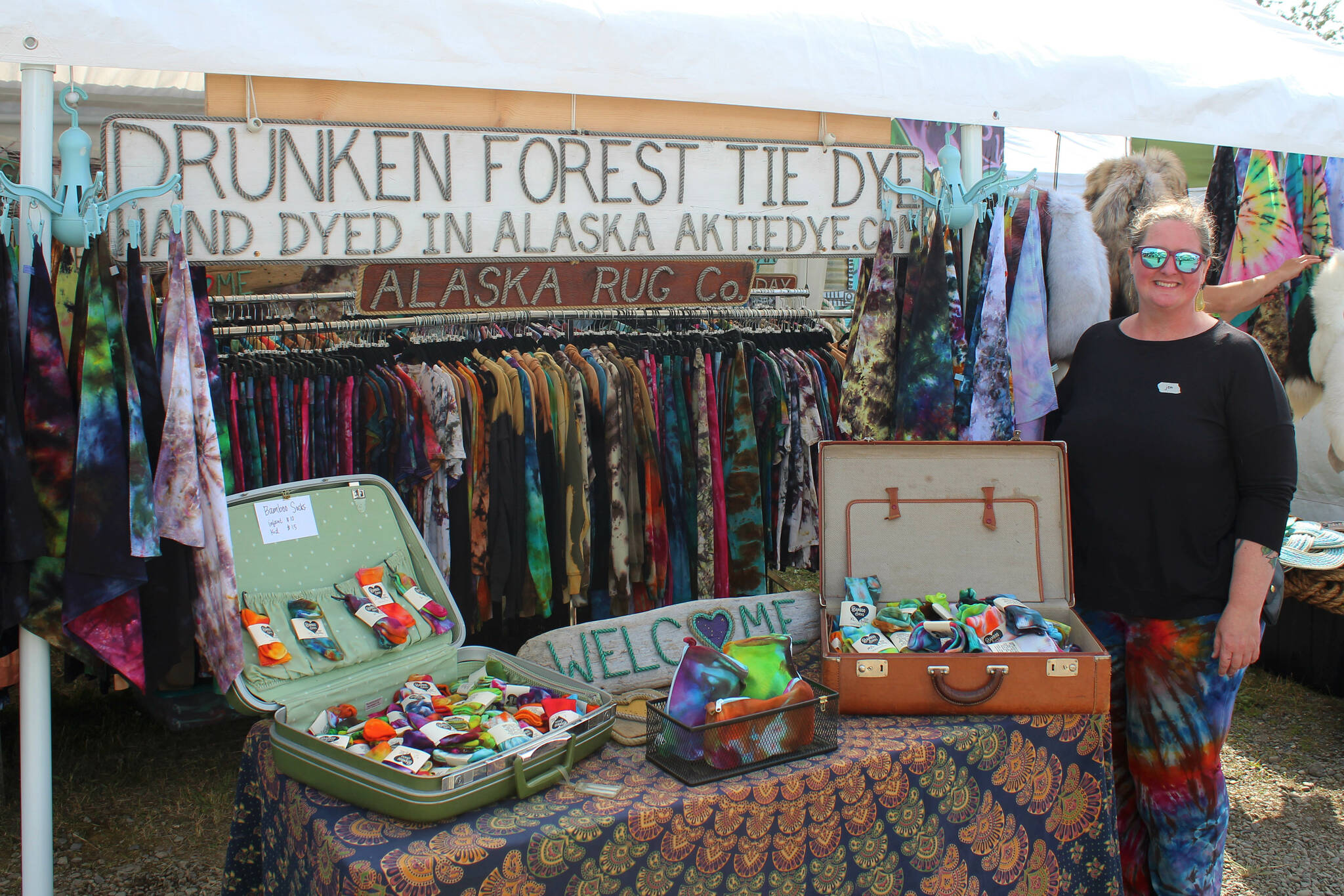 Drunken Forest Tie Dye owner Jen Luton stands near her vendor booth at Salmonfest on Friday, Aug. 4, 2023 in Ninilchik, Alaska. (Ashlyn O'Hara/Peninsula Clarion)